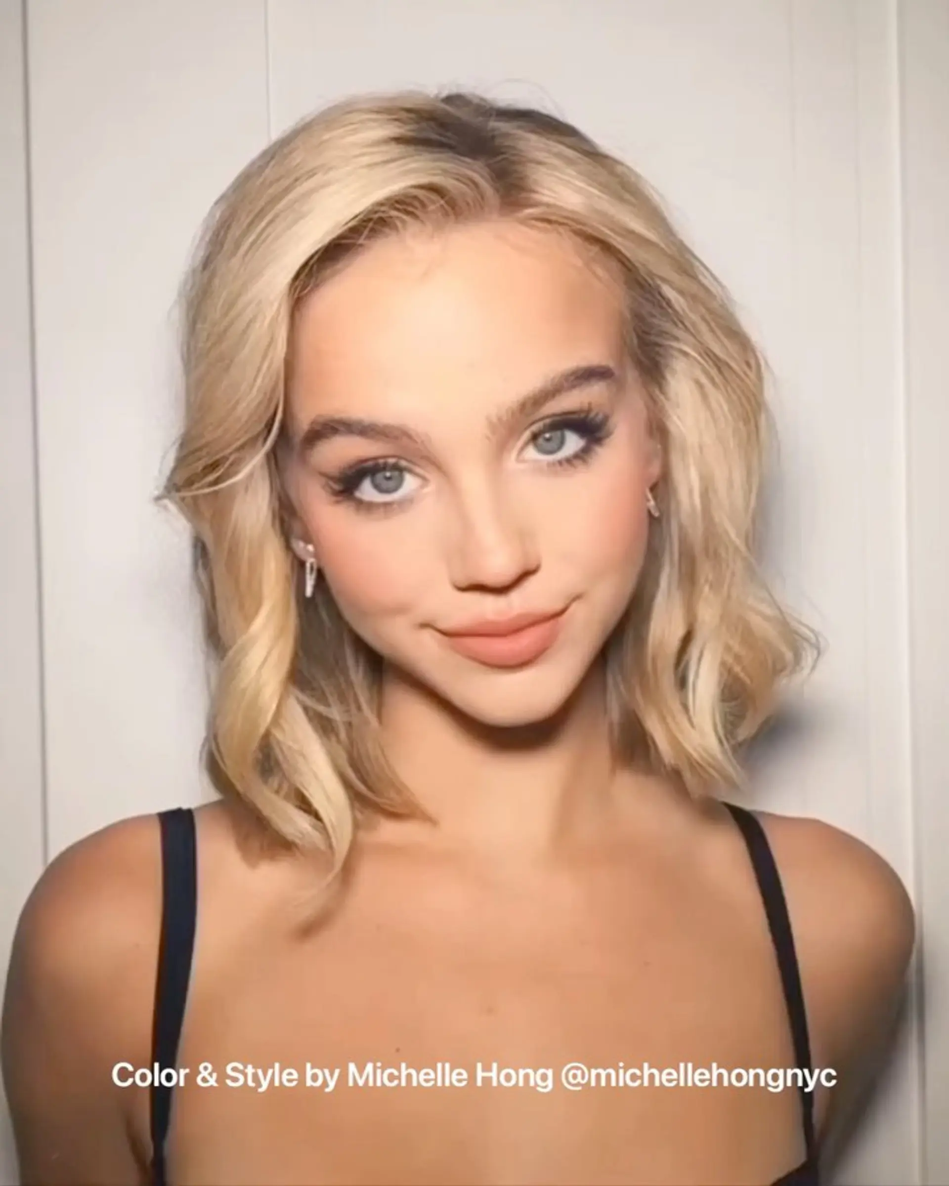 A bright blonde bob styled with soft, loose waves grazing just above the shoulders. 1