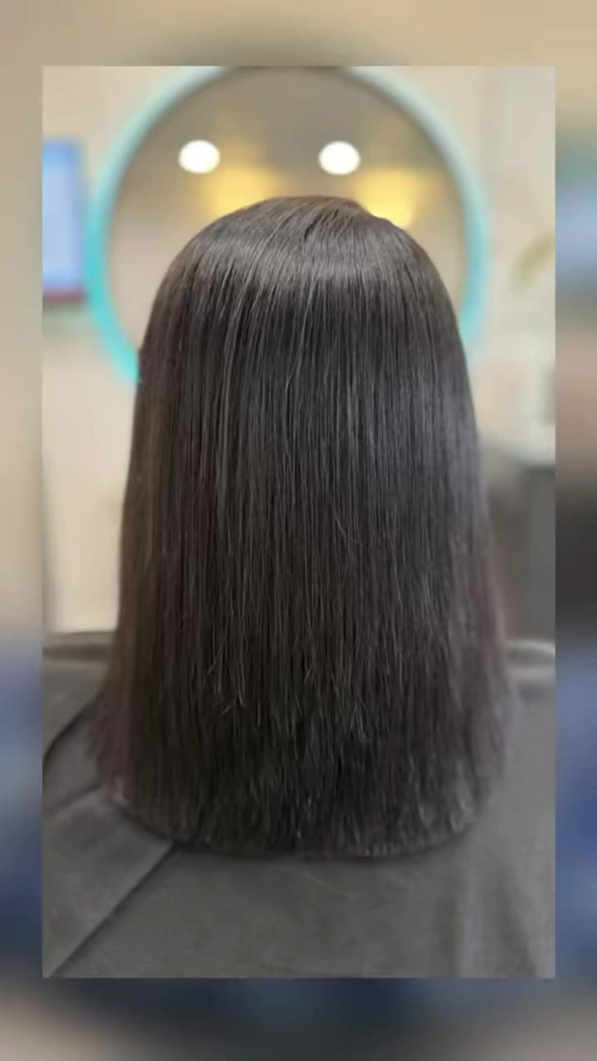 A pin-straight, glossy shoulder-length cut featuring an ultra-smooth finish and clean ends. 1