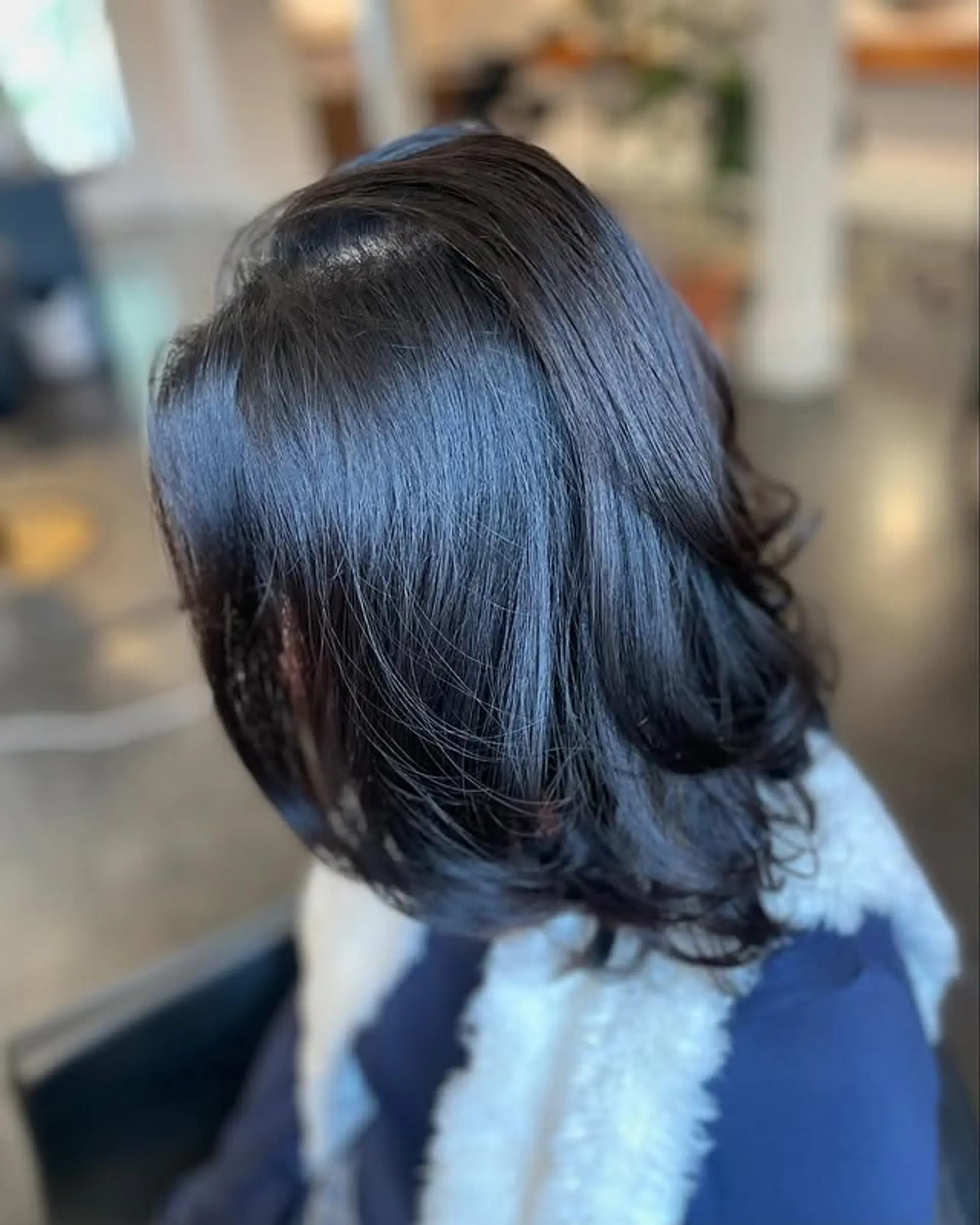 A polished, medium-length bob with a sleek finish, showcasing healthy, shiny strands and a subtle inward curl at the ends. 1