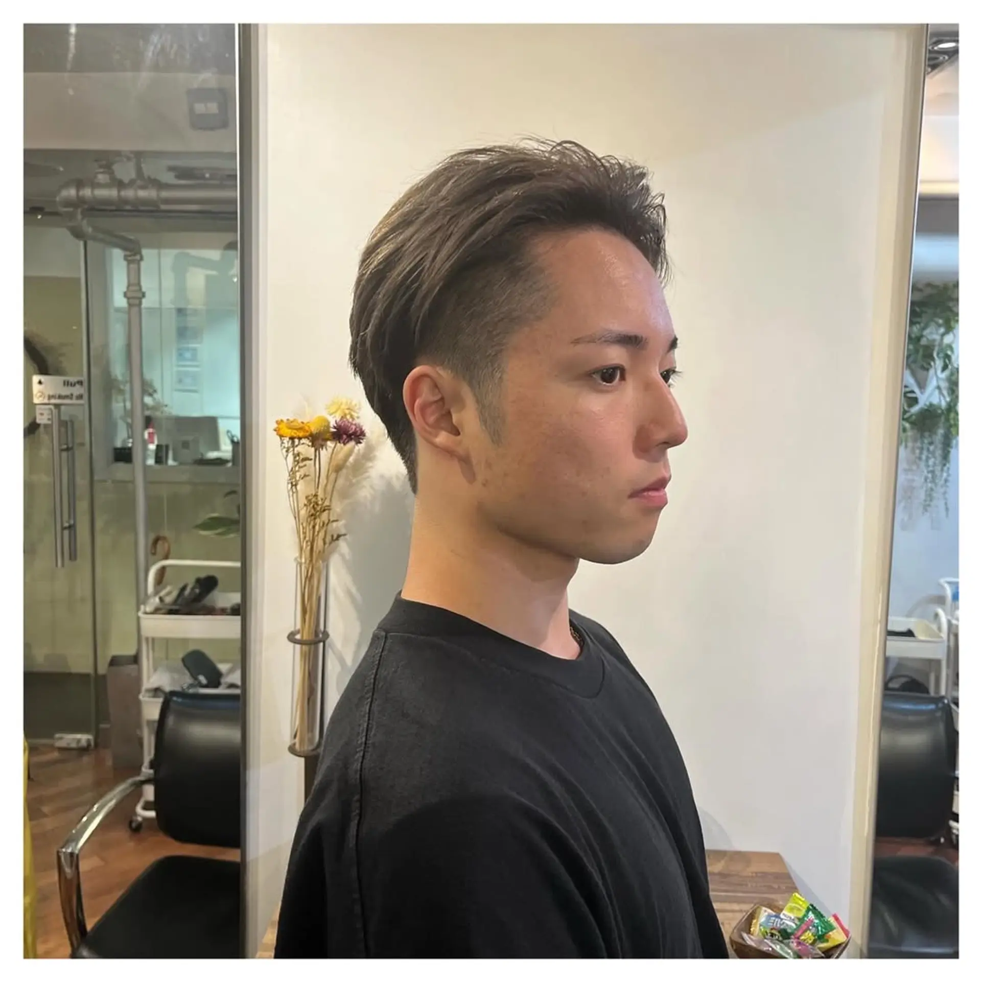 Features a short, faded haircut with textured top and modern silver highlights. 4