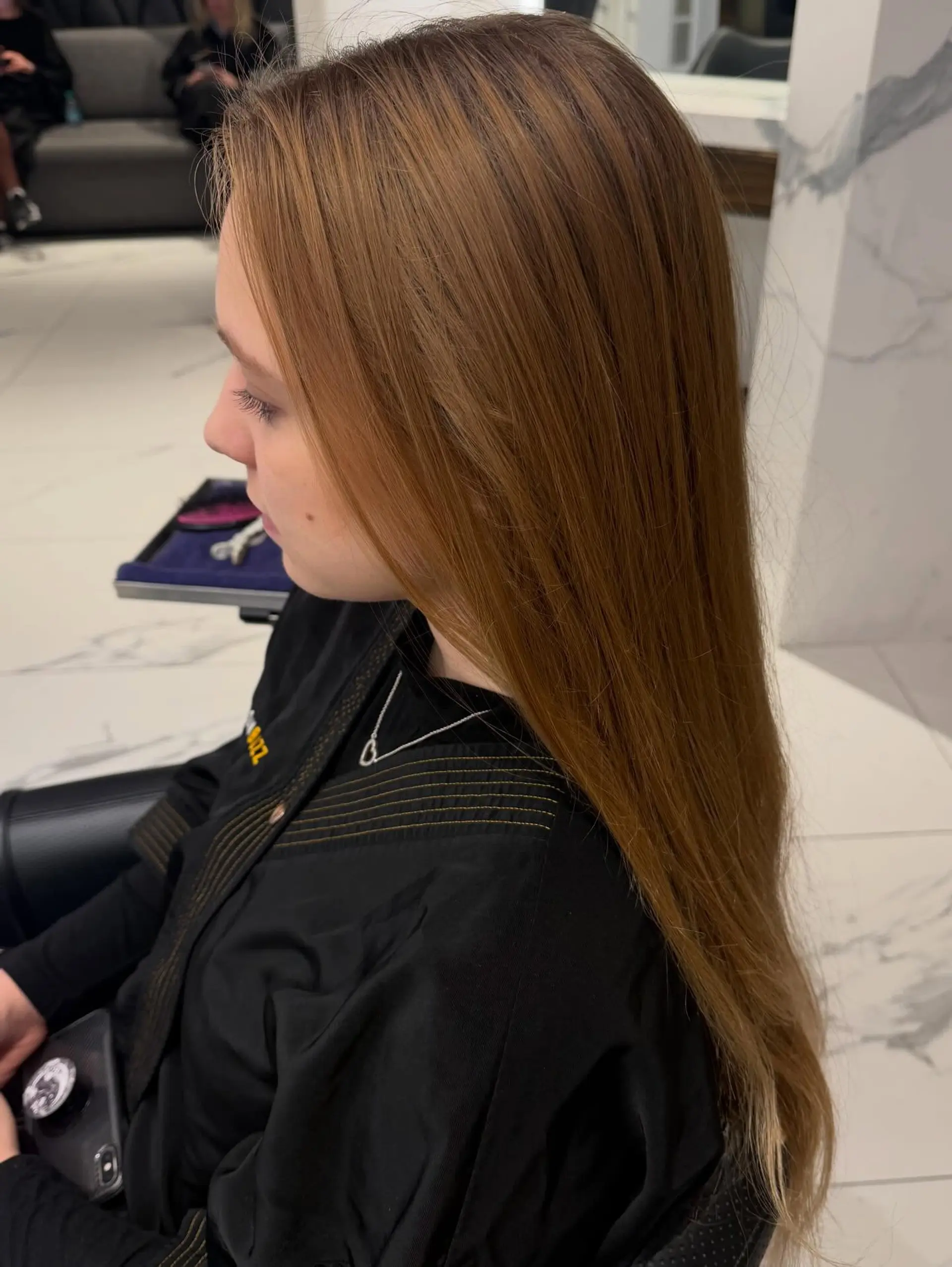 Straight, extra-long hair styled smoothly with a rich, glossy copper finish. 1