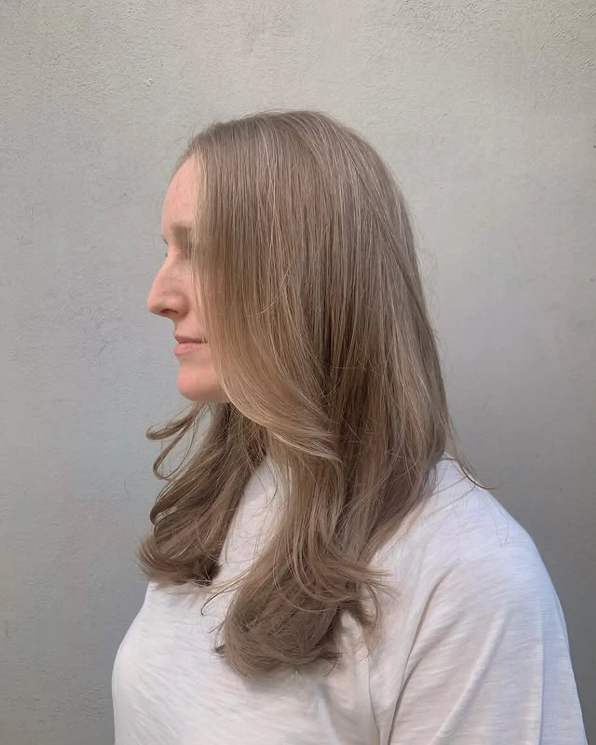 A long layered haircut with face-framing layers. 1