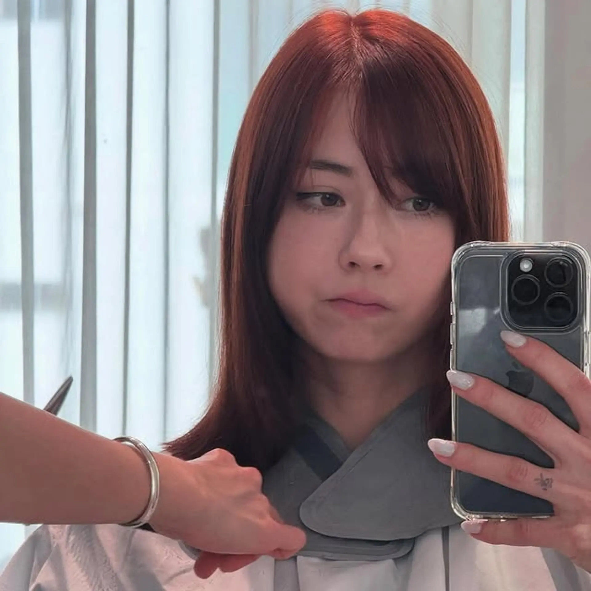 A medium-length layered lob with face-framing layers and soft bangs. 1