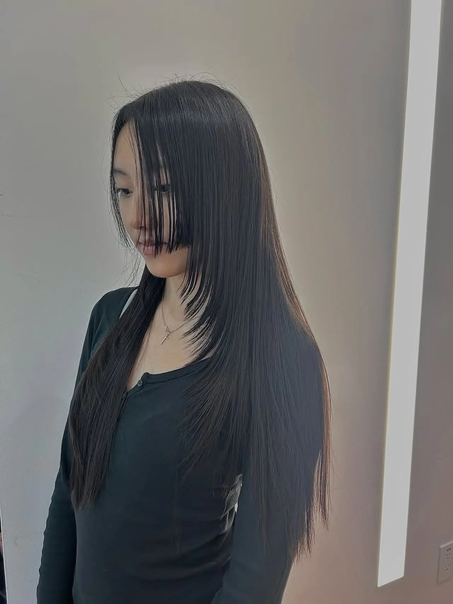 A choppy, layered wolf cut with blunt bangs. 1