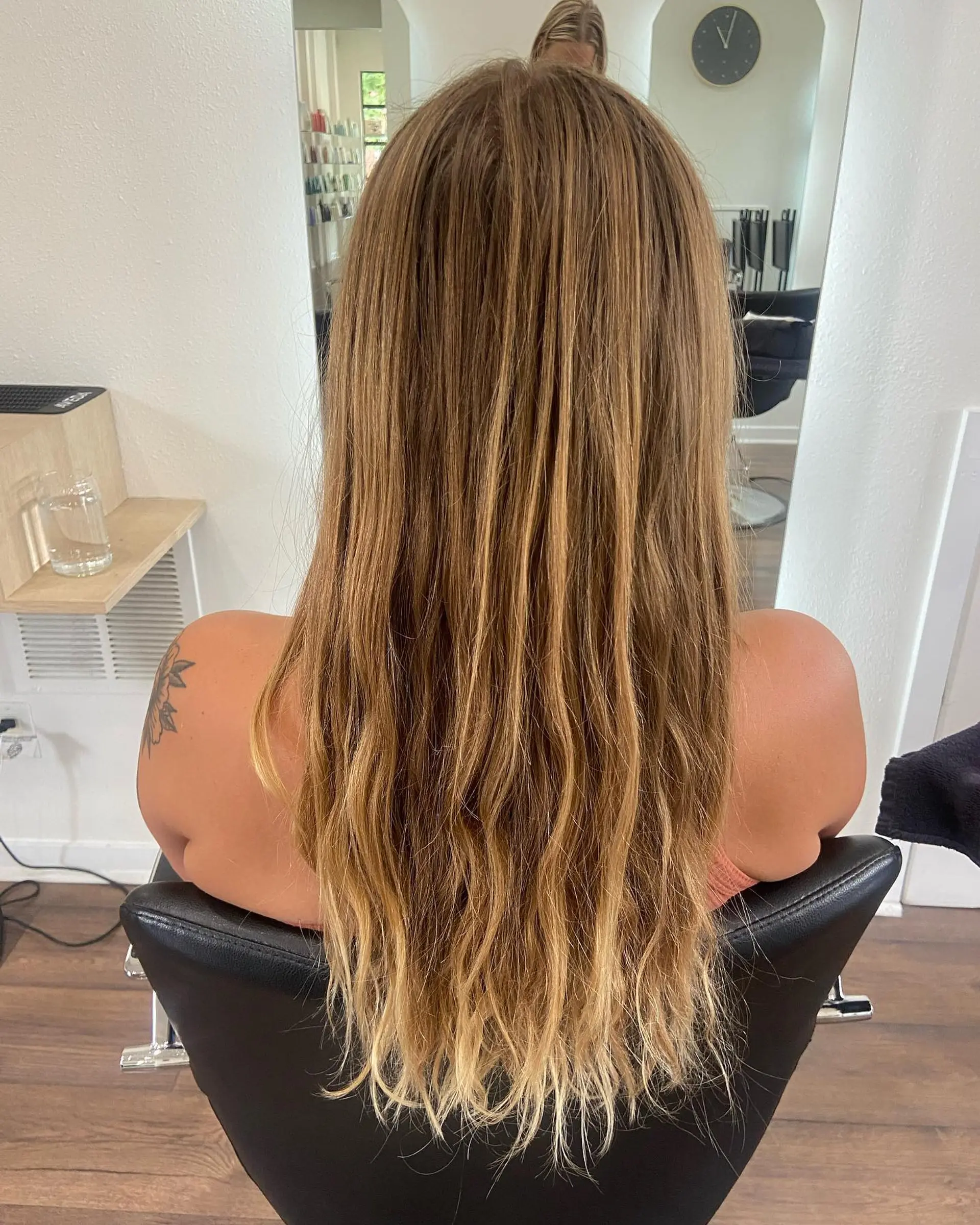 Long, warm golden blonde hair with lived-in highlights and soft textured ends. 1