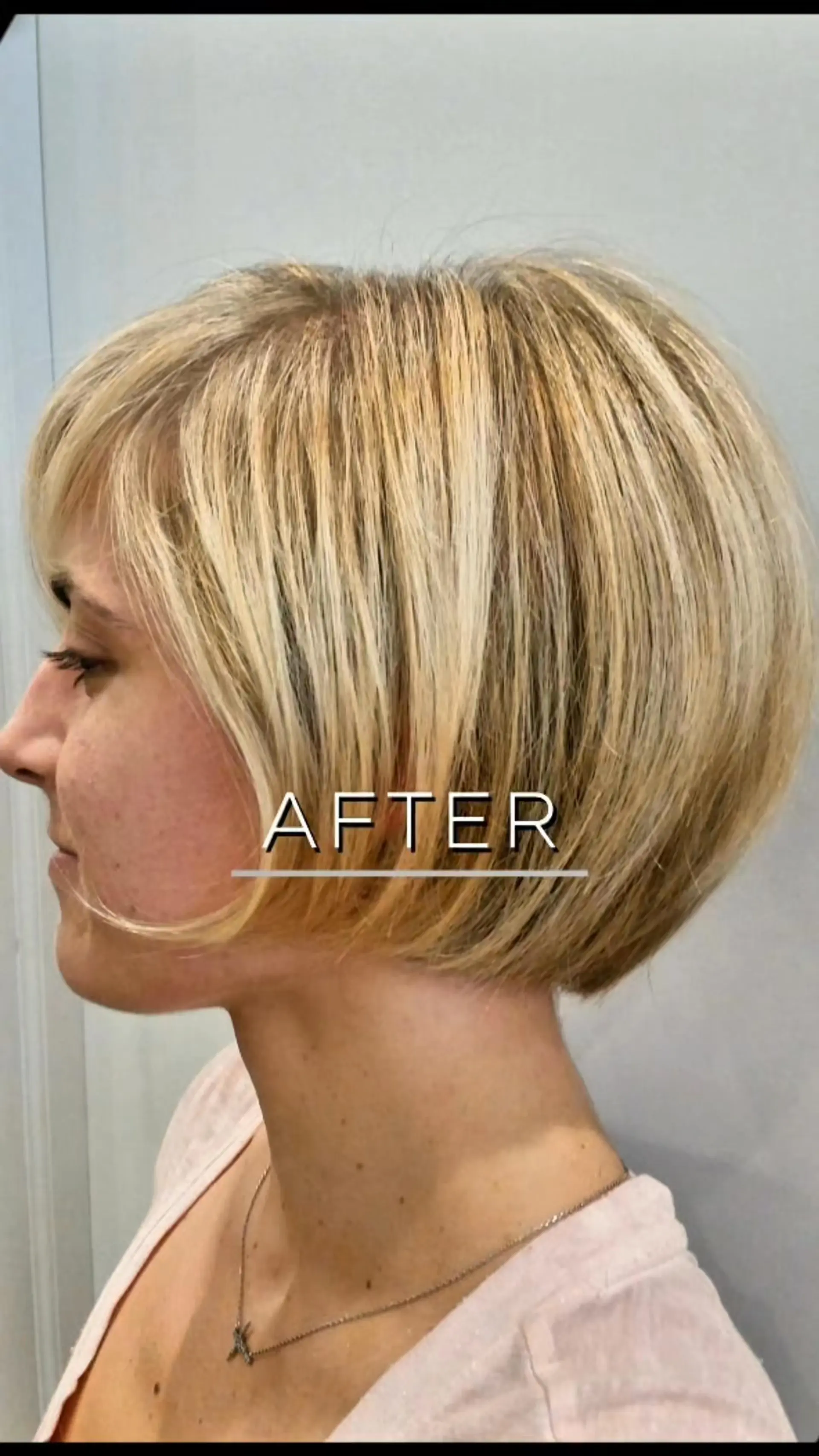 A textured chin-length retro bob haircut featuring rounded ends and dimensional blonde highlights. 1
