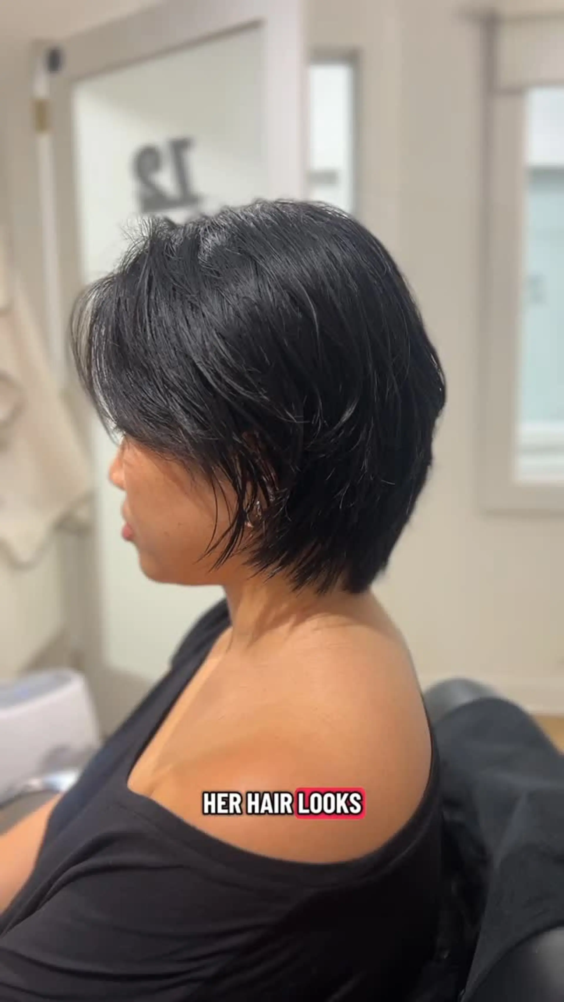 A textured short bixie cut with feathered, piecey layers and soft side bangs framing the face. 1