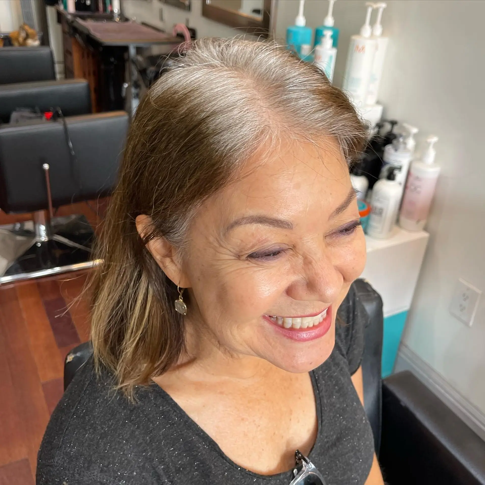 Medium-length straight hair featuring a seamless grey blending transformation that matches natural silver roots. 1
