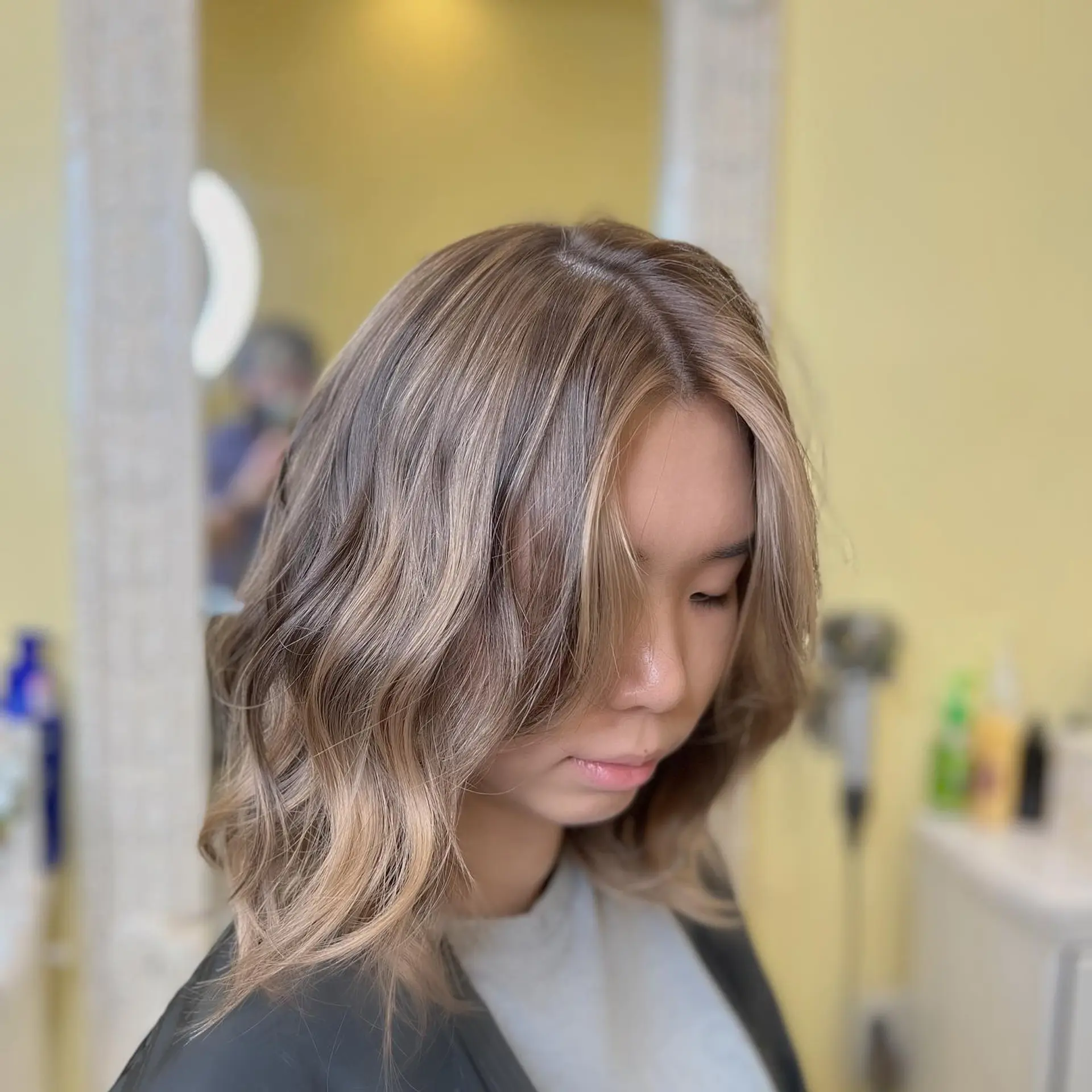 A trendy bronde wavy lob with lots of volume and movement. 1