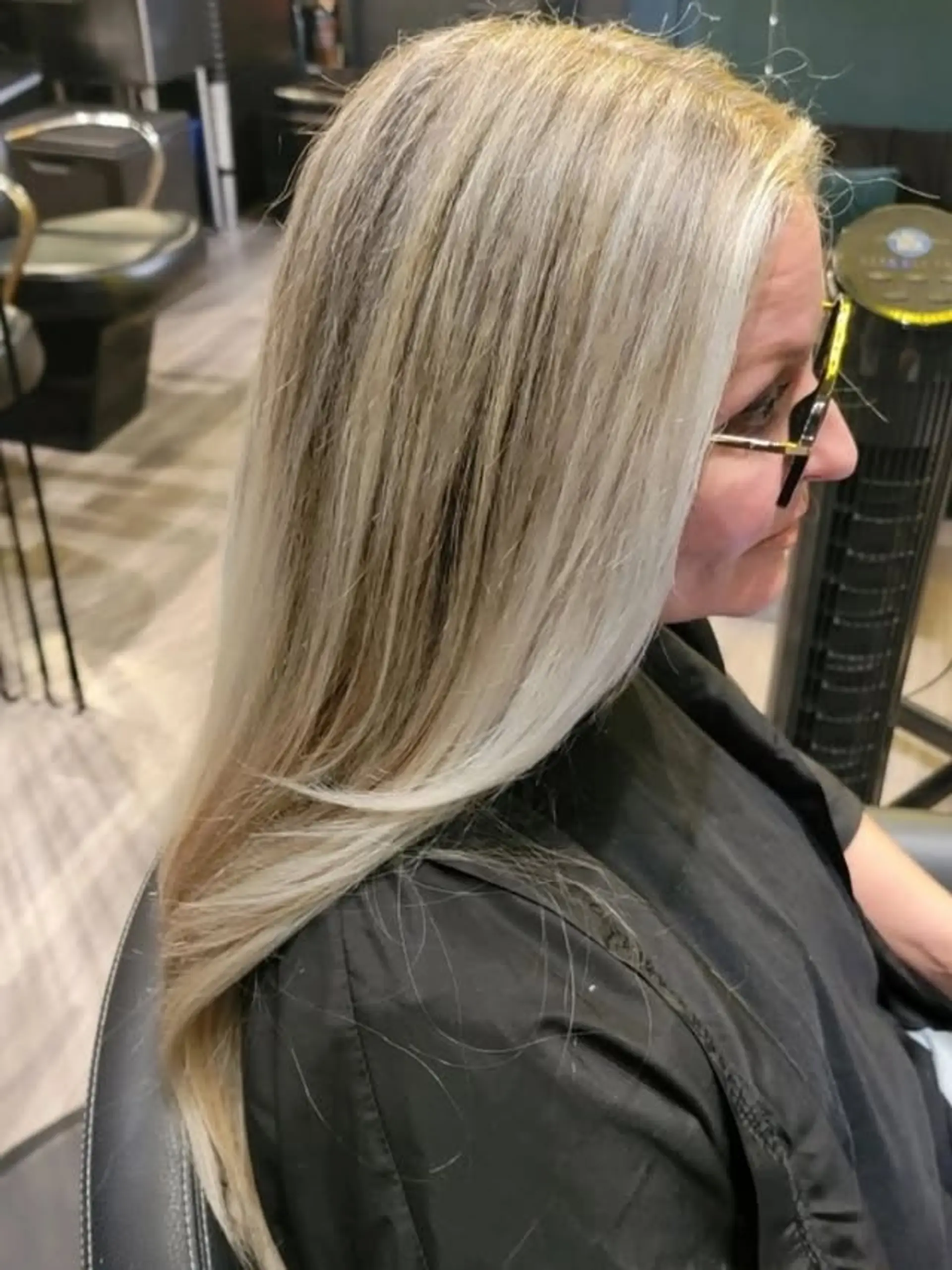 Long, straight hair featuring a stunning ash blonde balayage with a subtle root melt for a natural, blended effect. 1