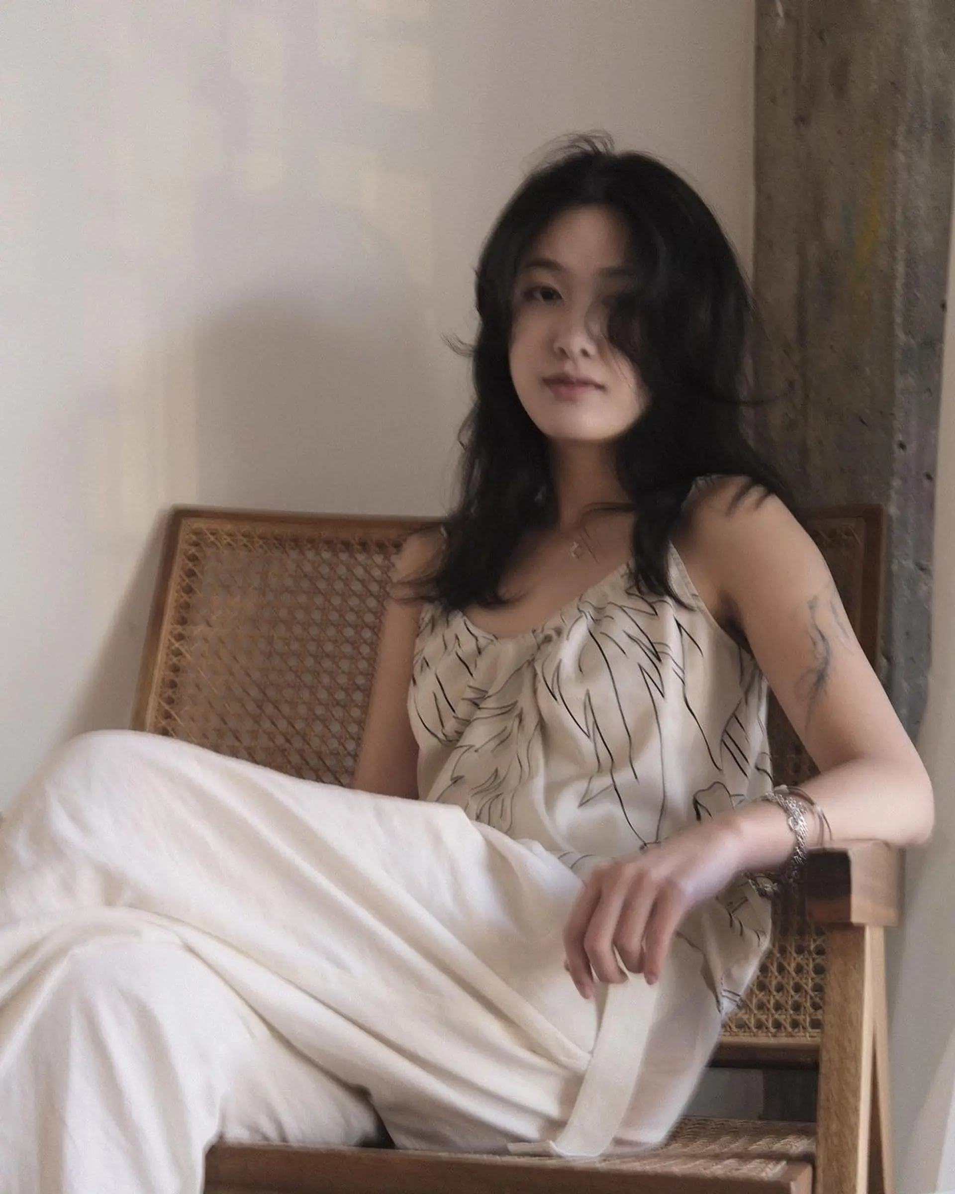 Long, wavy black hair with face-framing layers and a loose, natural texture. 4