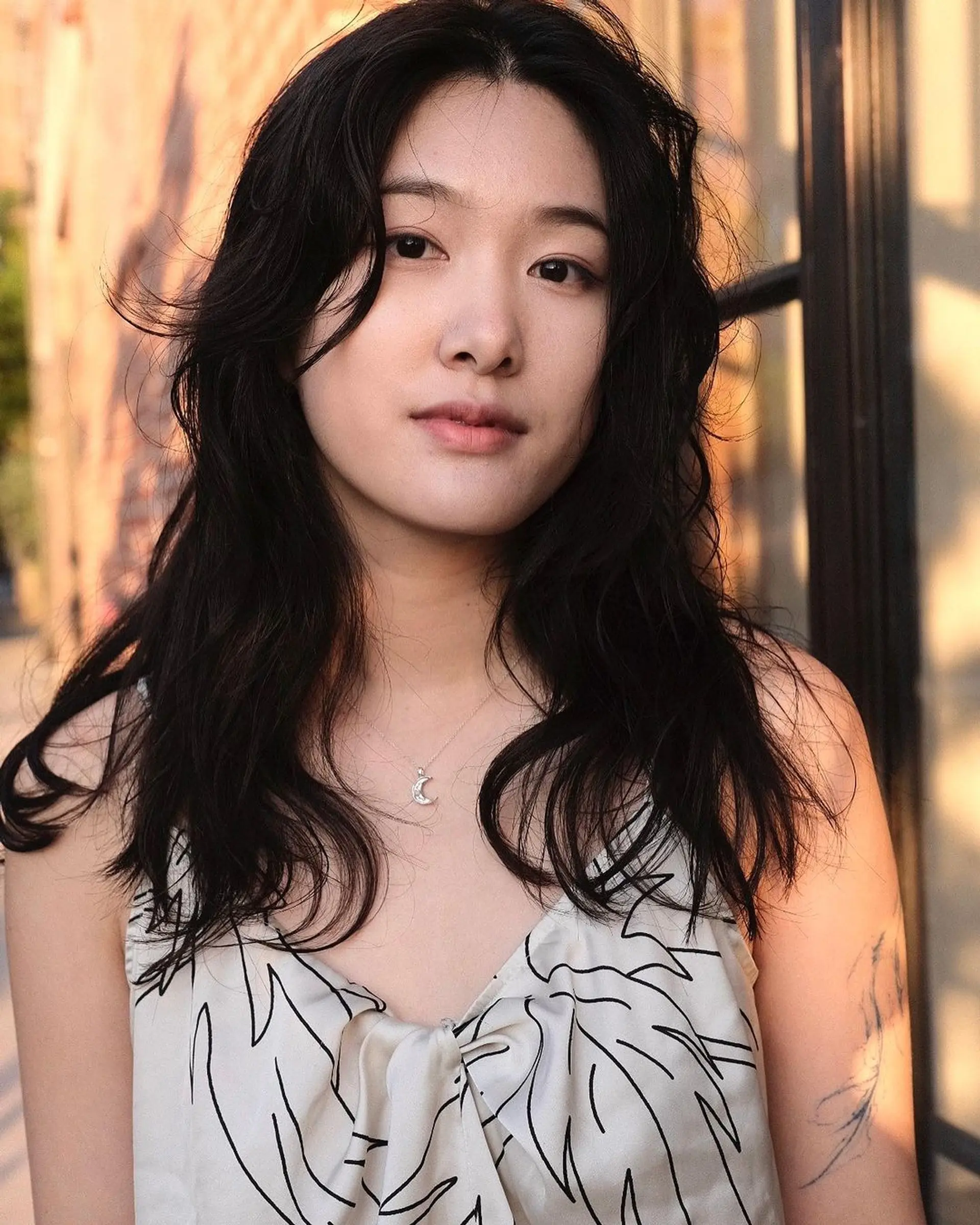 Long, wavy black hair with face-framing layers and a loose, natural texture. 1