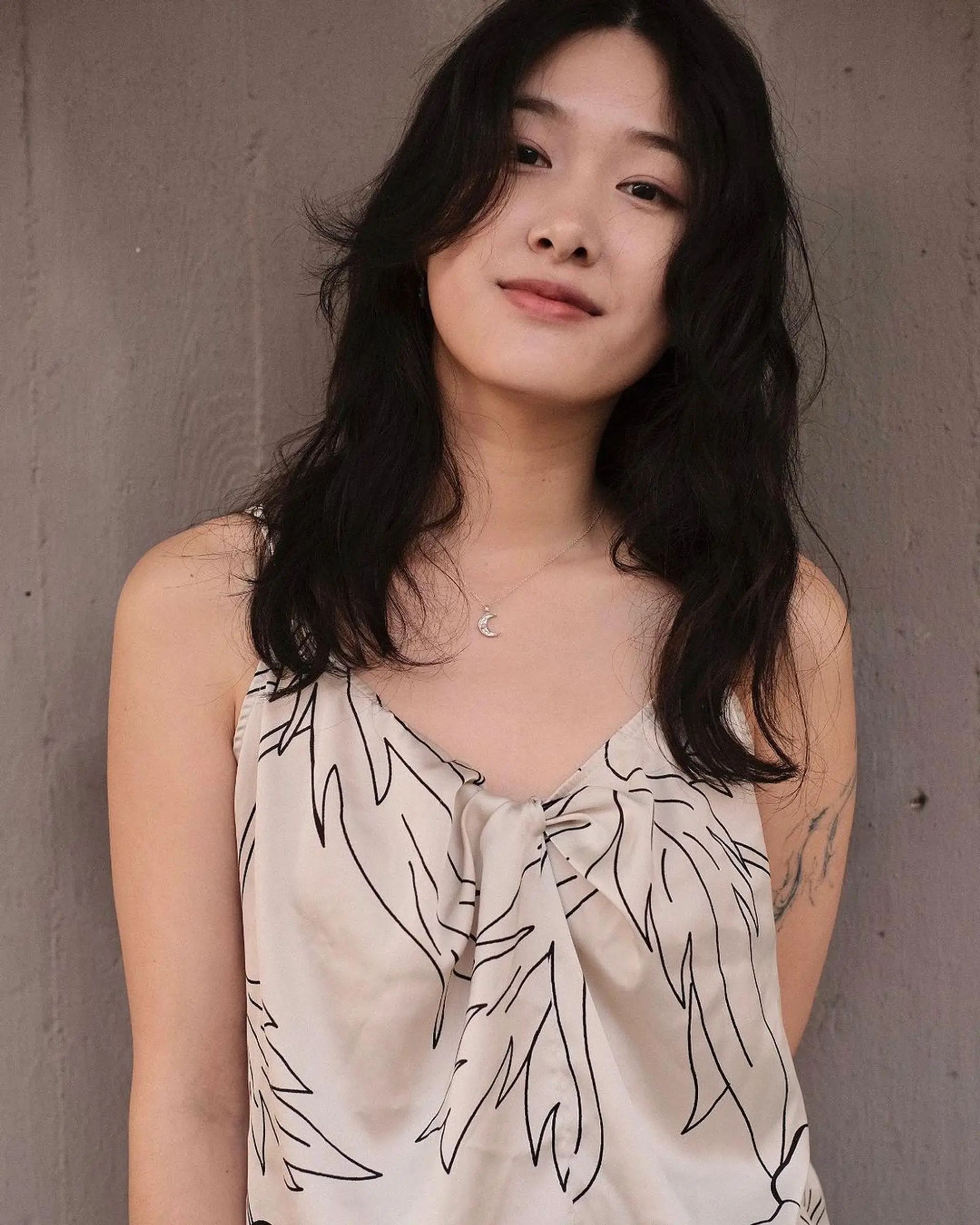 Long, wavy black hair with face-framing layers and a loose, natural texture. 3