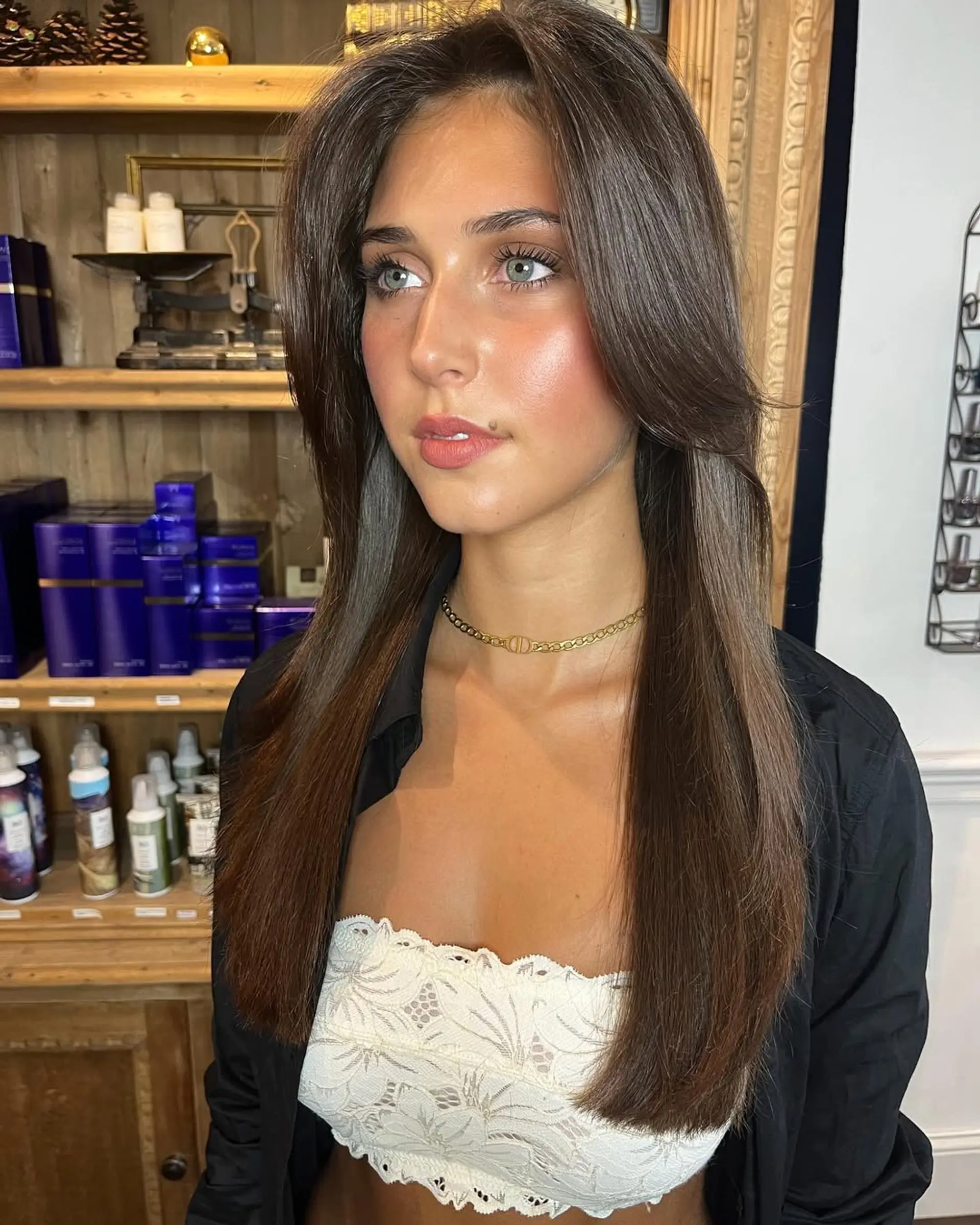 Long, chestnut brown straight hair with a middle part, featuring face-framing layers and a glossy finish. 4