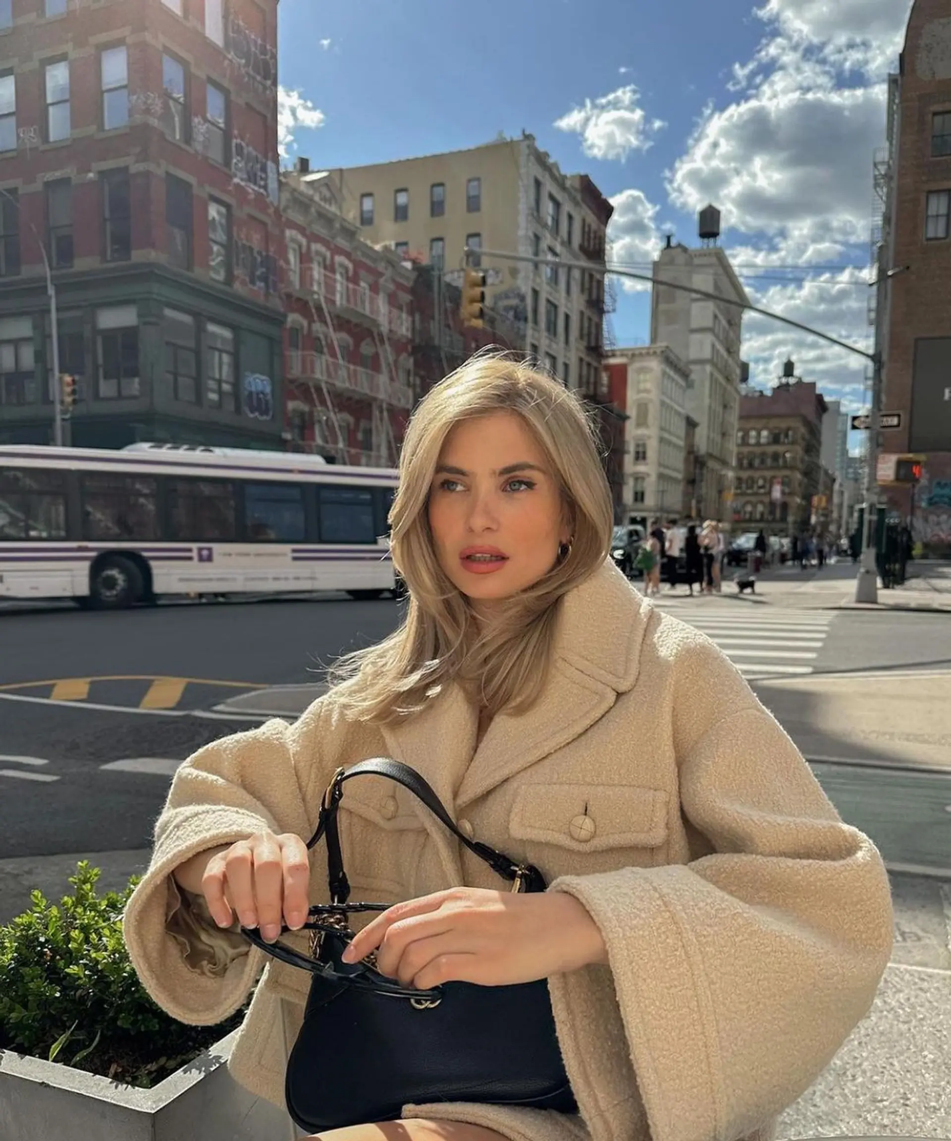 Medium-length, wavy hair with side-swept layers and a voluminous blonde, golden hue. 2