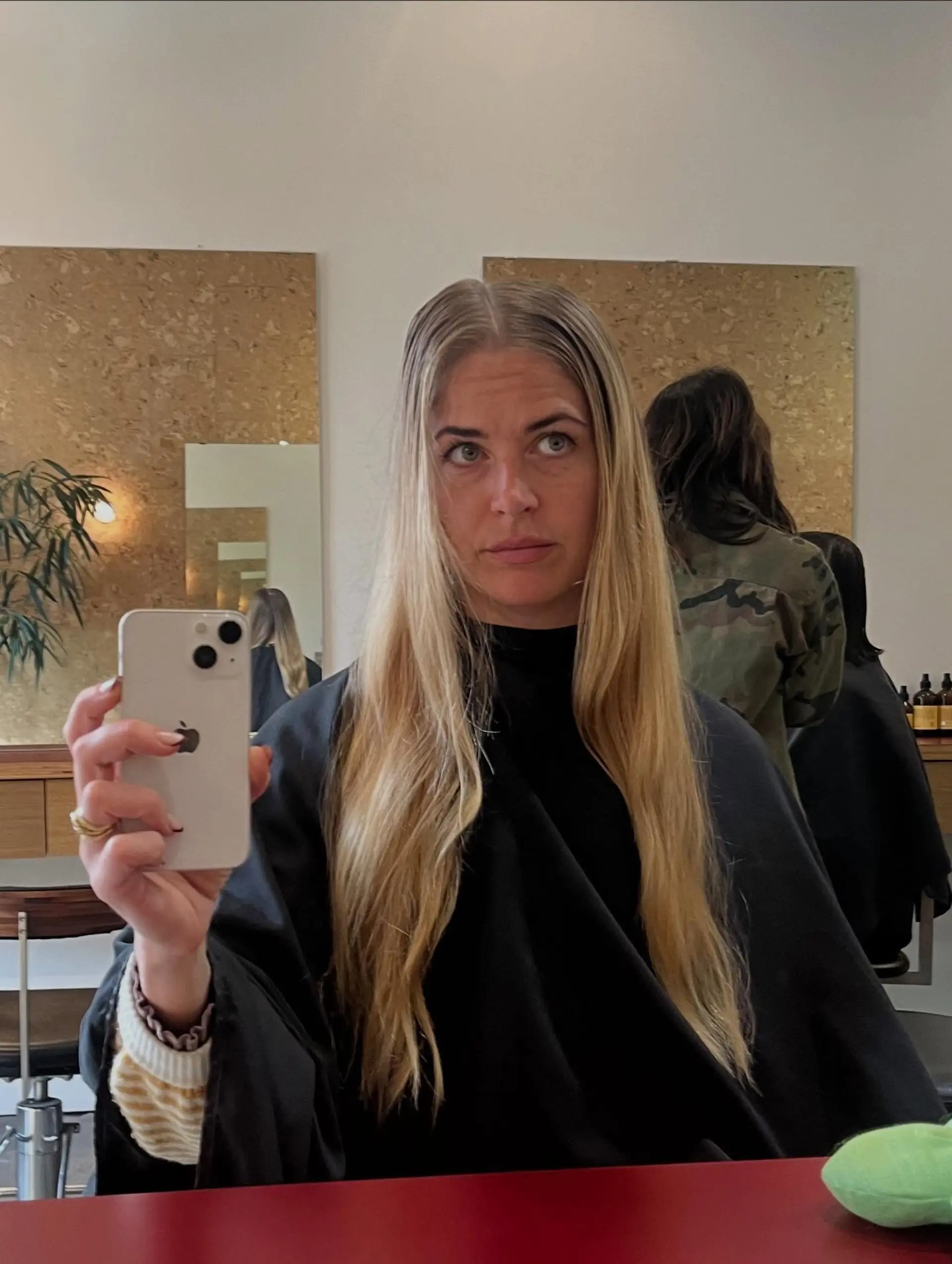 Long straight blonde hair with a center part. 1