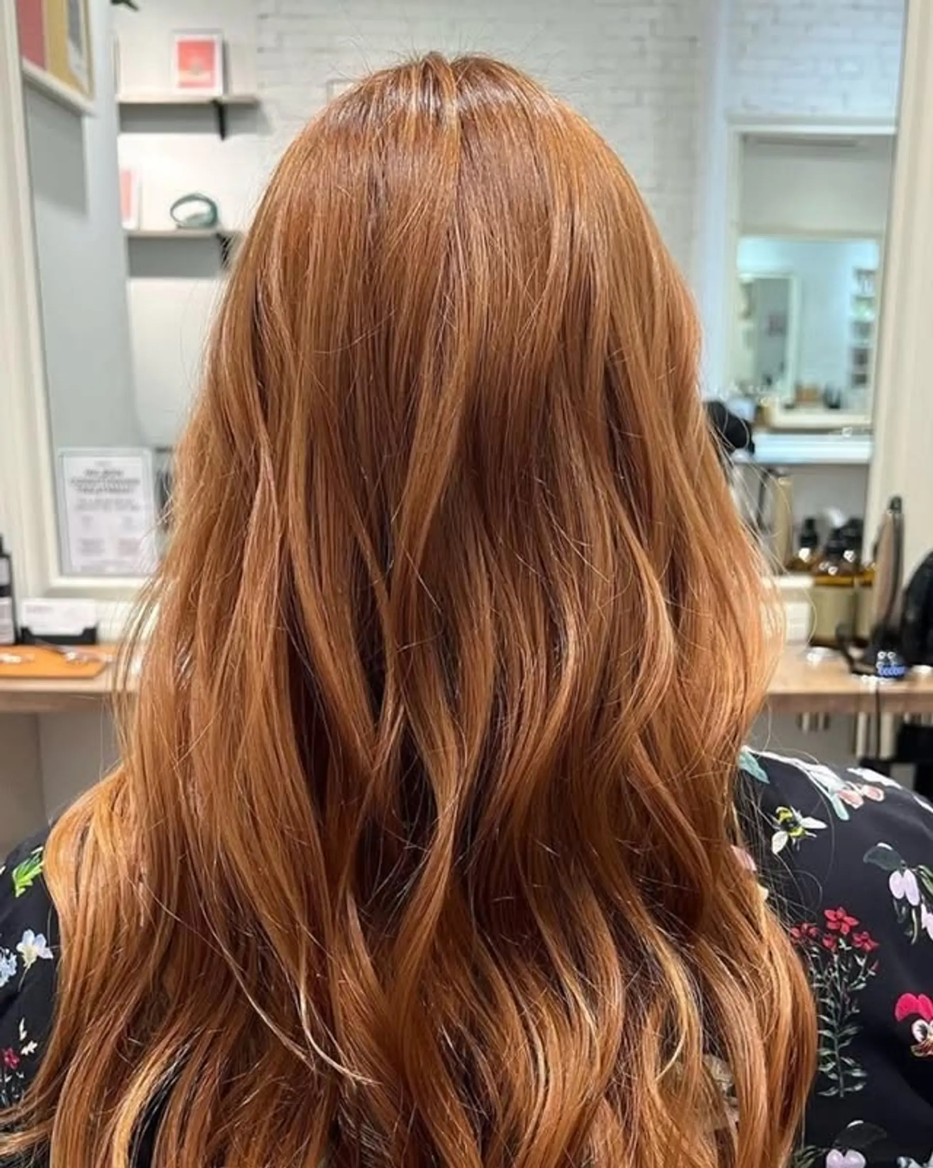 Long, wavy copper hair with subtle highlights and soft layers. 1