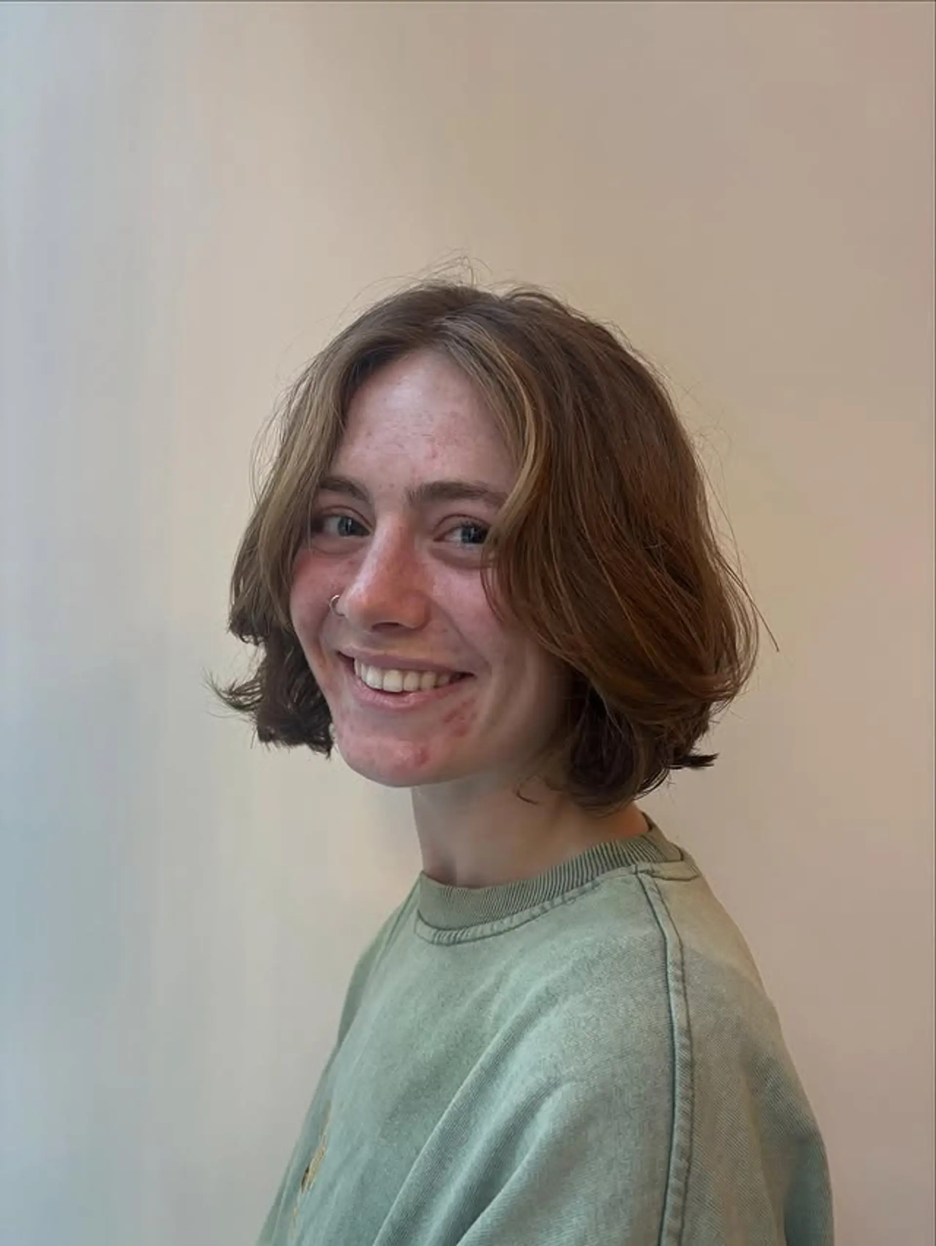 A stylish wavy bob with subtle face-framing highlights. 1