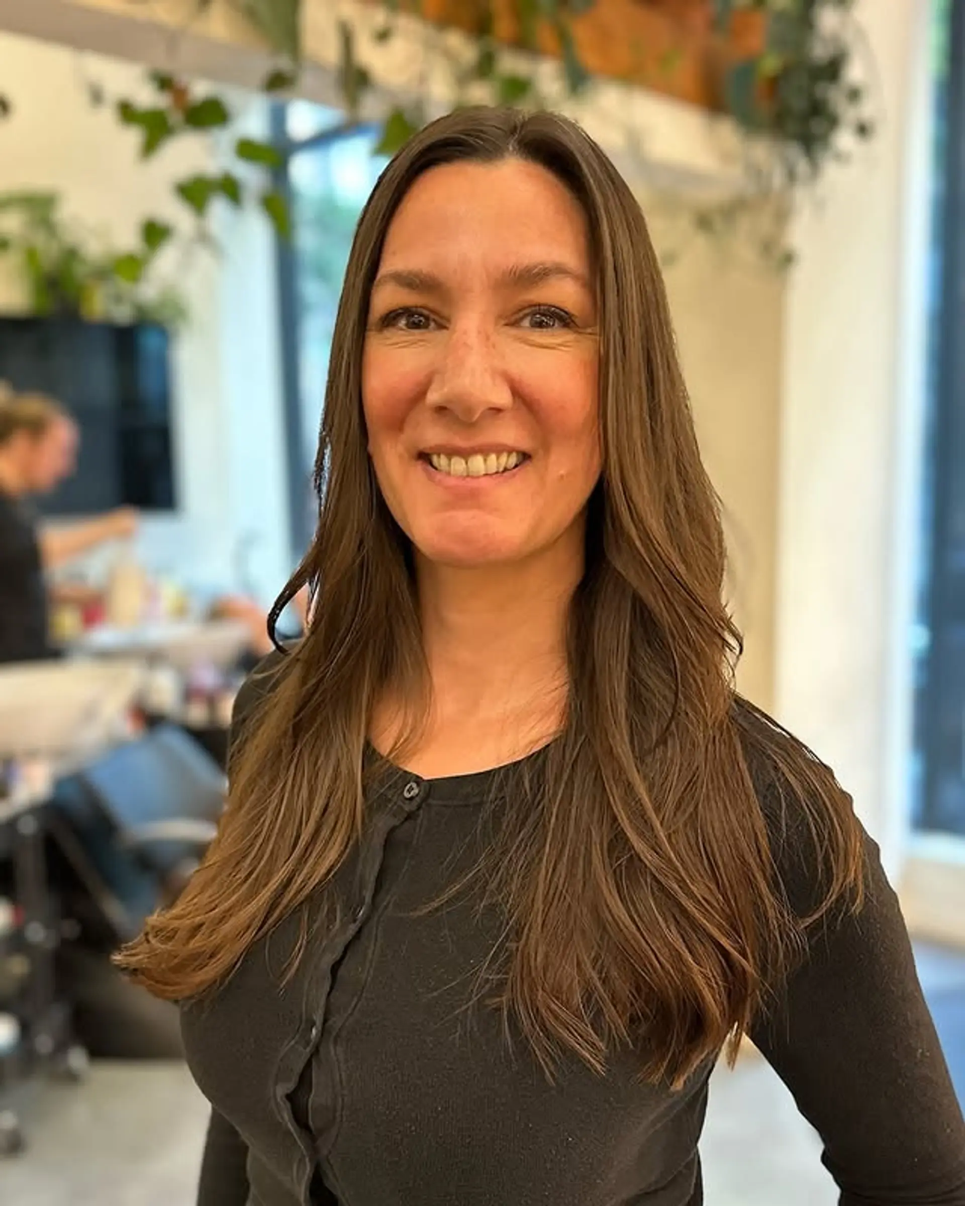 A long, layered haircut with face-framing layers. 1