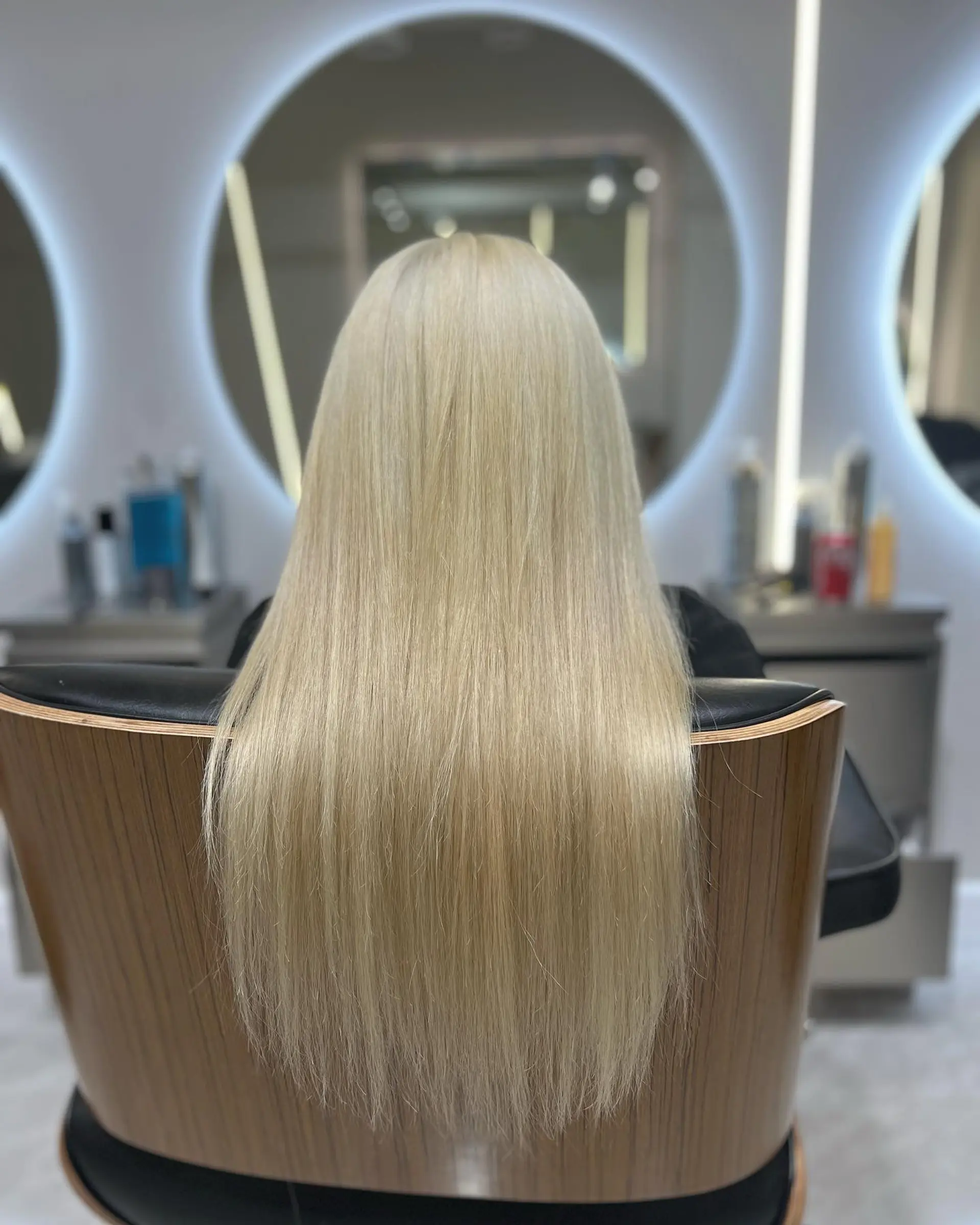 Long, straight hair with a vibrant platinum blonde color. 1
