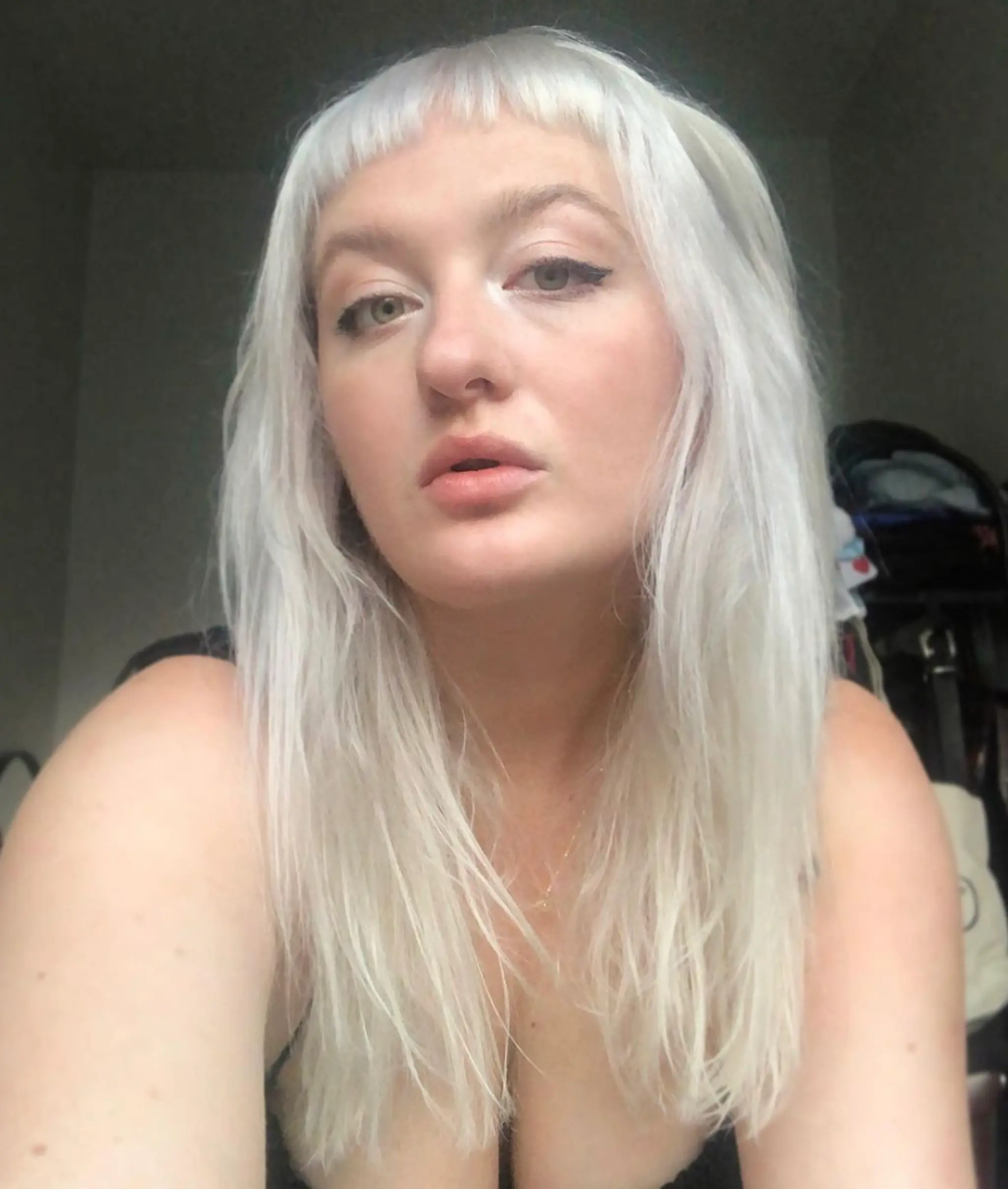 Medium-length, straight, platinum blonde hair with blunt bangs and wispy layers.

Color by @simabeautynyc
Cut by @juliamannino_hair
