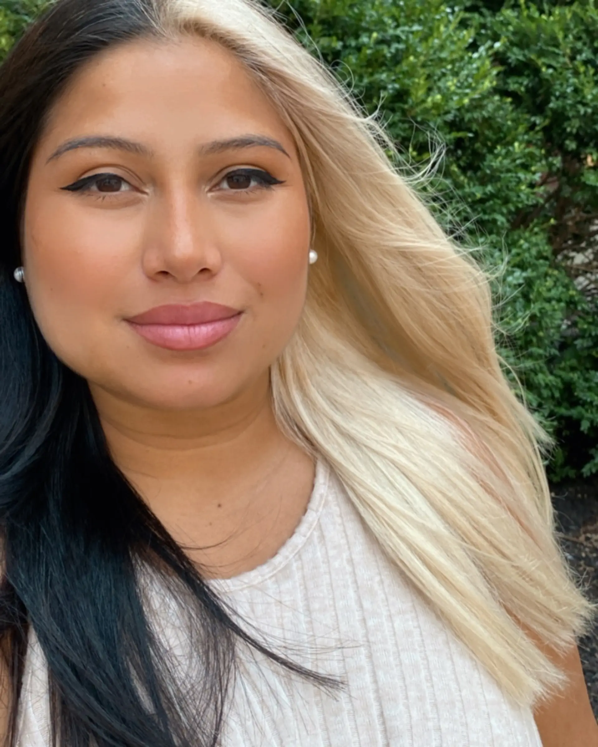 A dramatic split dye style with jet black hair on one side and brilliant platinum blonde on the other. 1