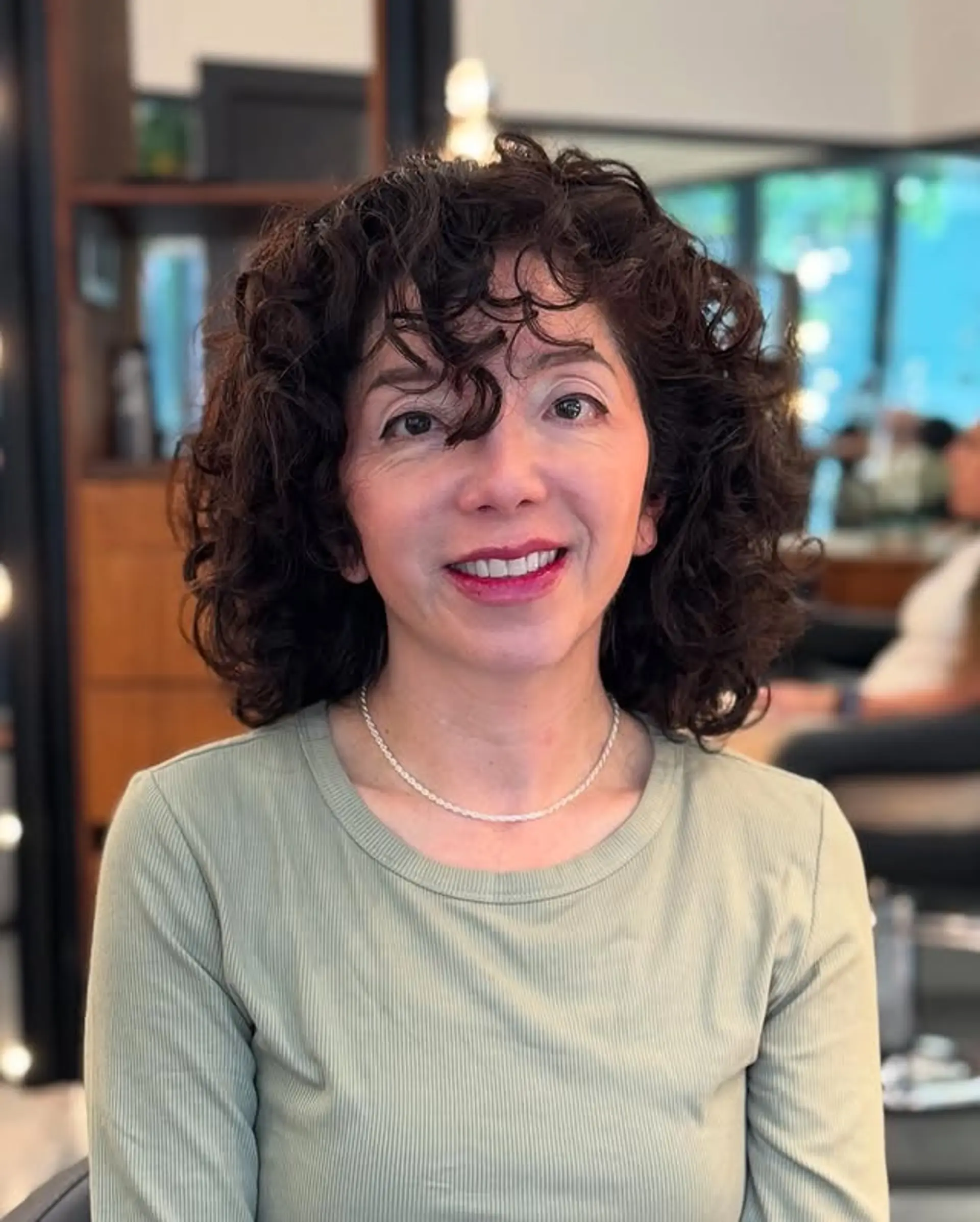 A shoulder-length shag with defined curls and flattering bangs. 1