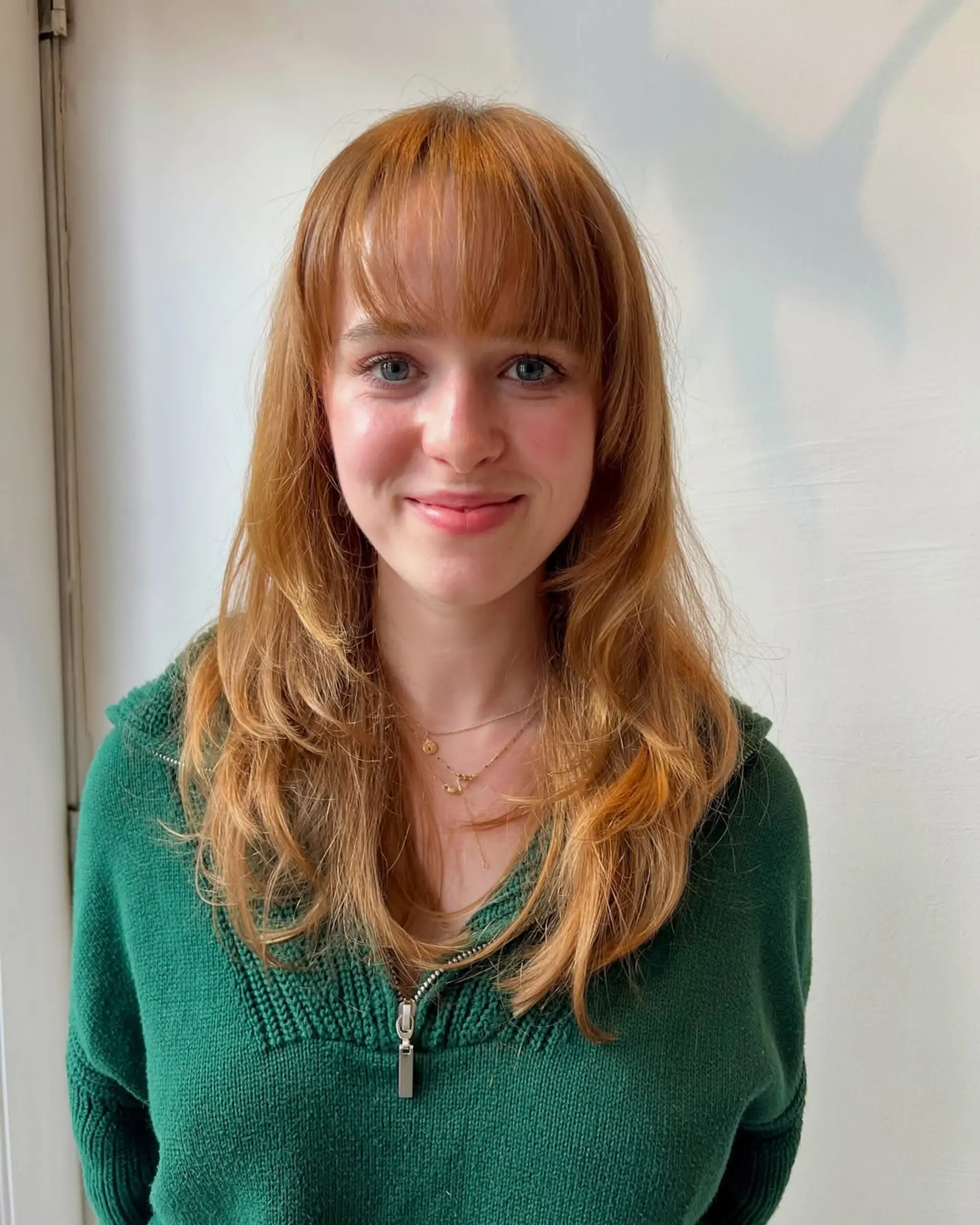 A medium-length layered cut with Bardot bangs. 1