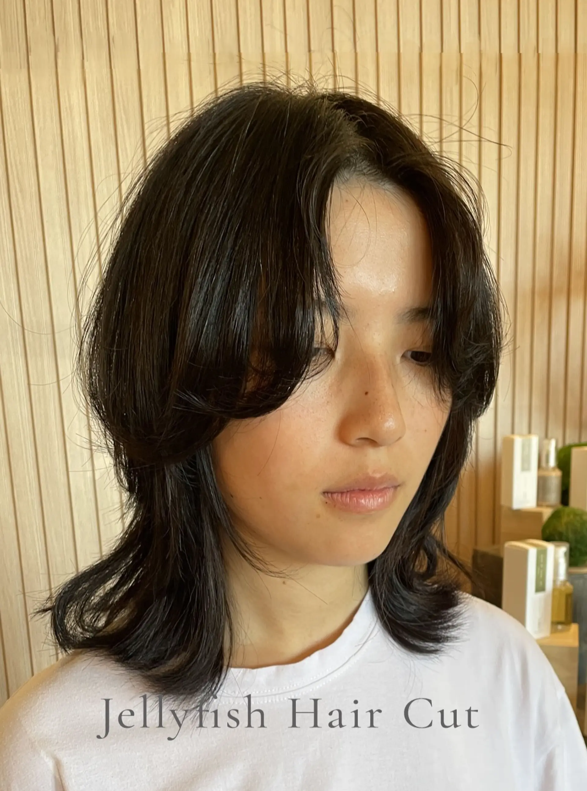A medium-length jellyfish haircut with rounded, face-framing upper layers and longer outward-flipped lengths underneath. 1