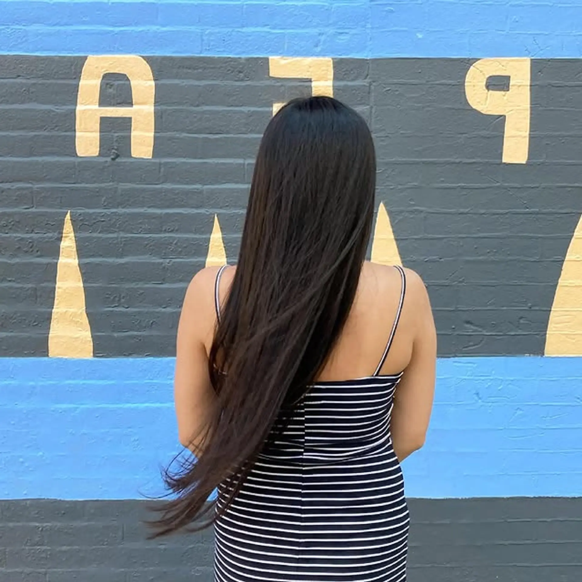 A classic and elegant long, straight hairstyle with a sleek finish. 1