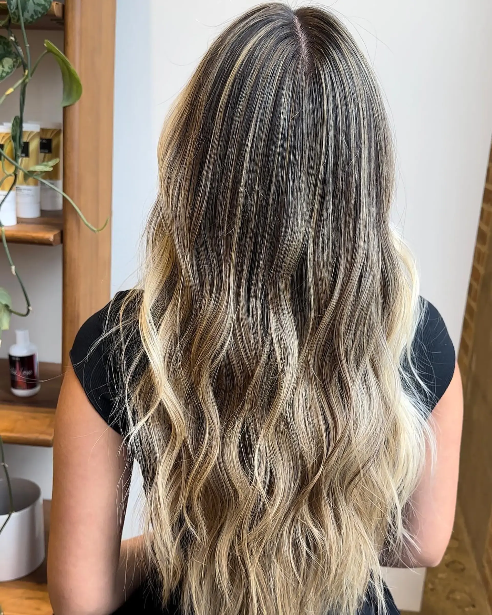 Long, beachy waves with a blonde balayage and ombre color melt. 1