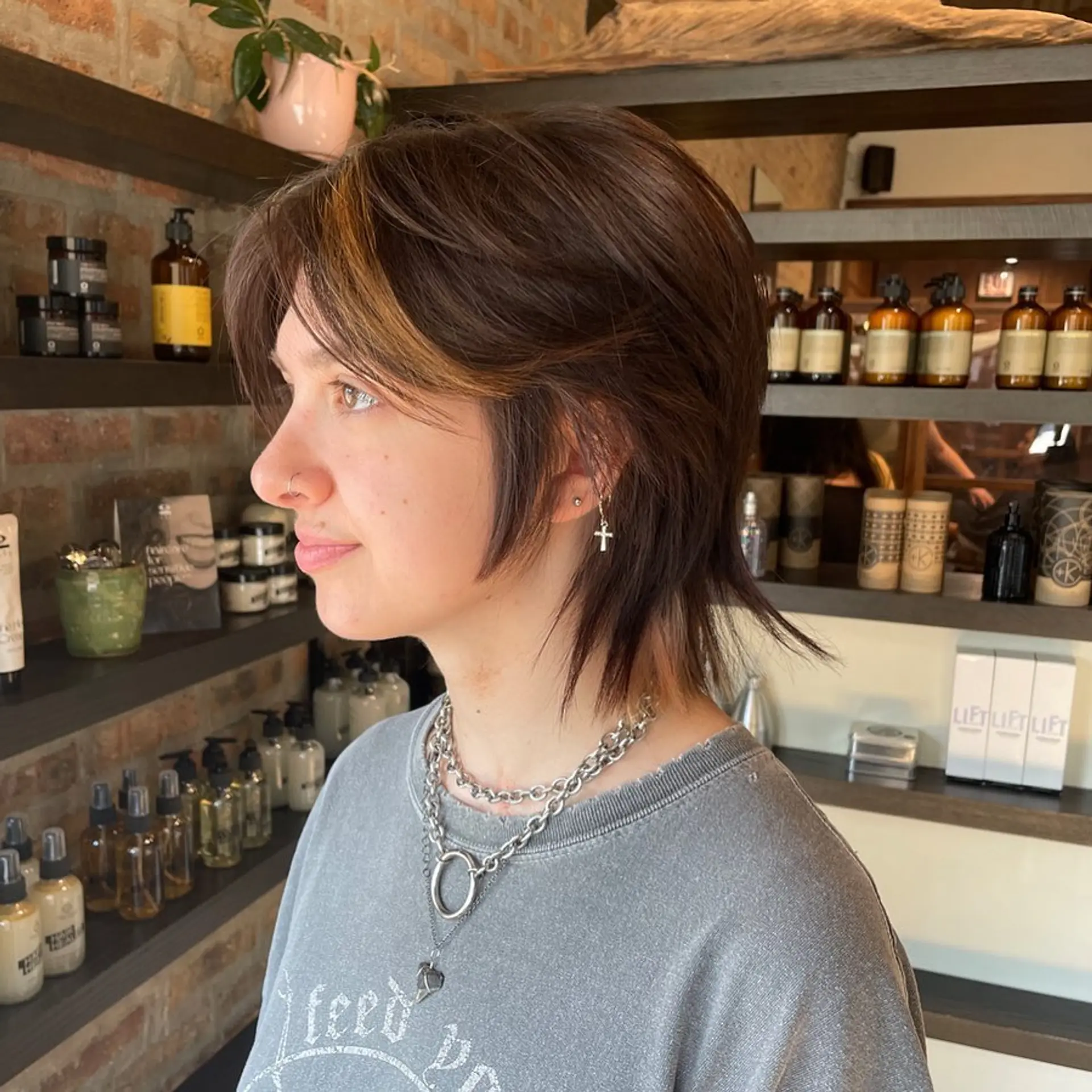 A trendy shag haircut with choppy layers and face-framing highlights. 1