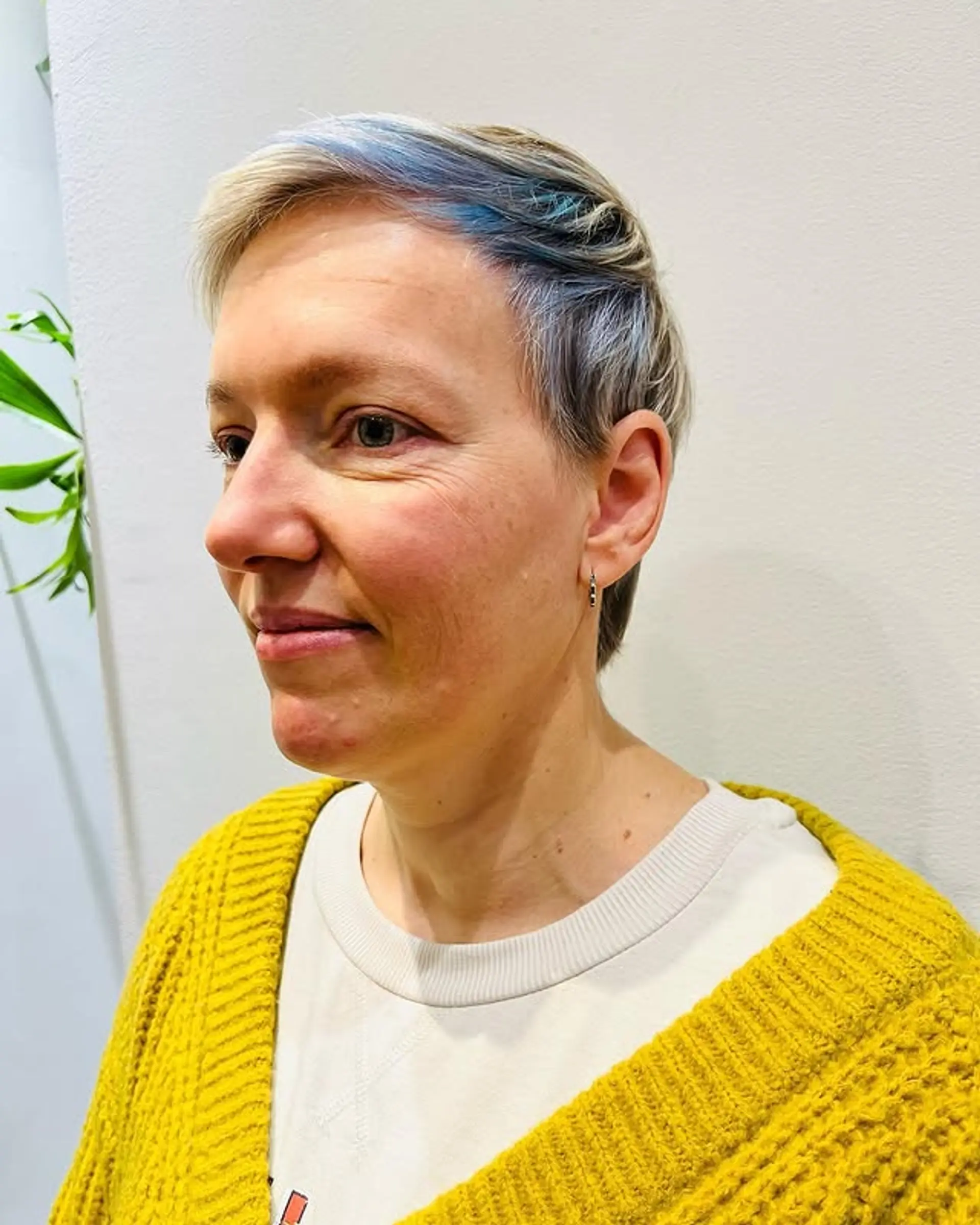 A short, textured pixie cut with peekaboo color. 1