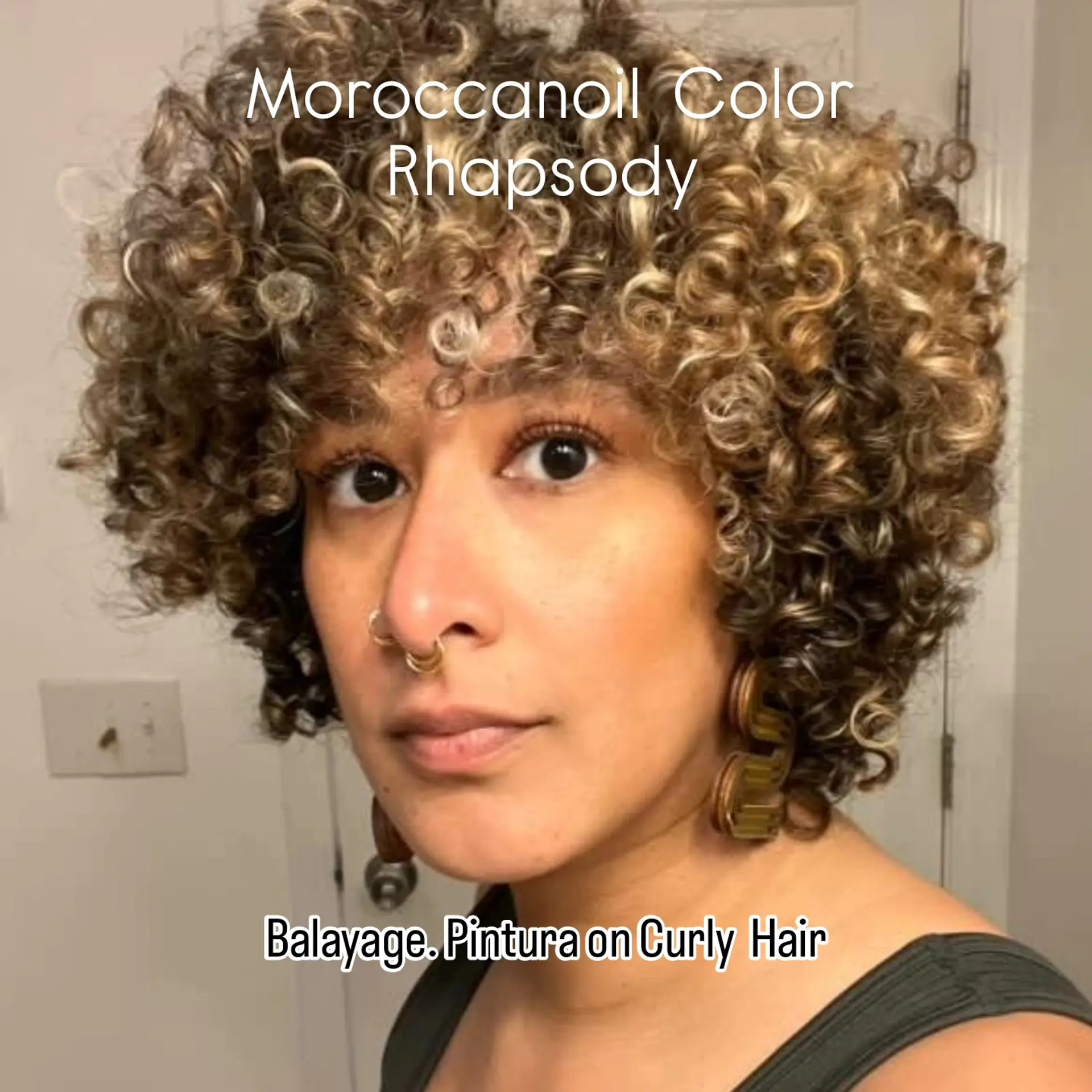 Voluminous curly crop with defined ringlets, curly fringe bangs, and dimensional golden blonde pintura balayage highlights. 1