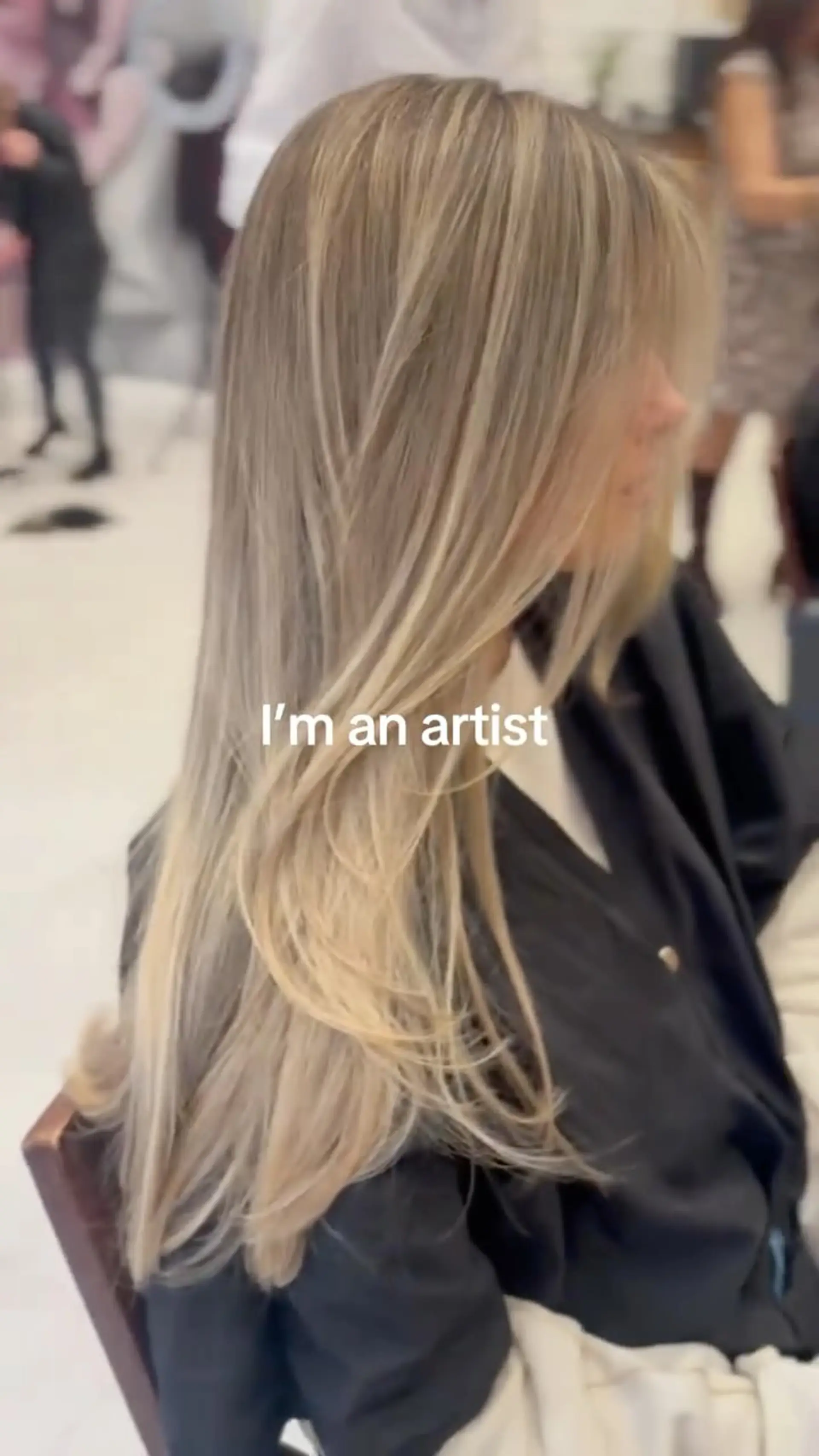 Long ash blonde hair styled with face-framing layers and a polished blowout. 1