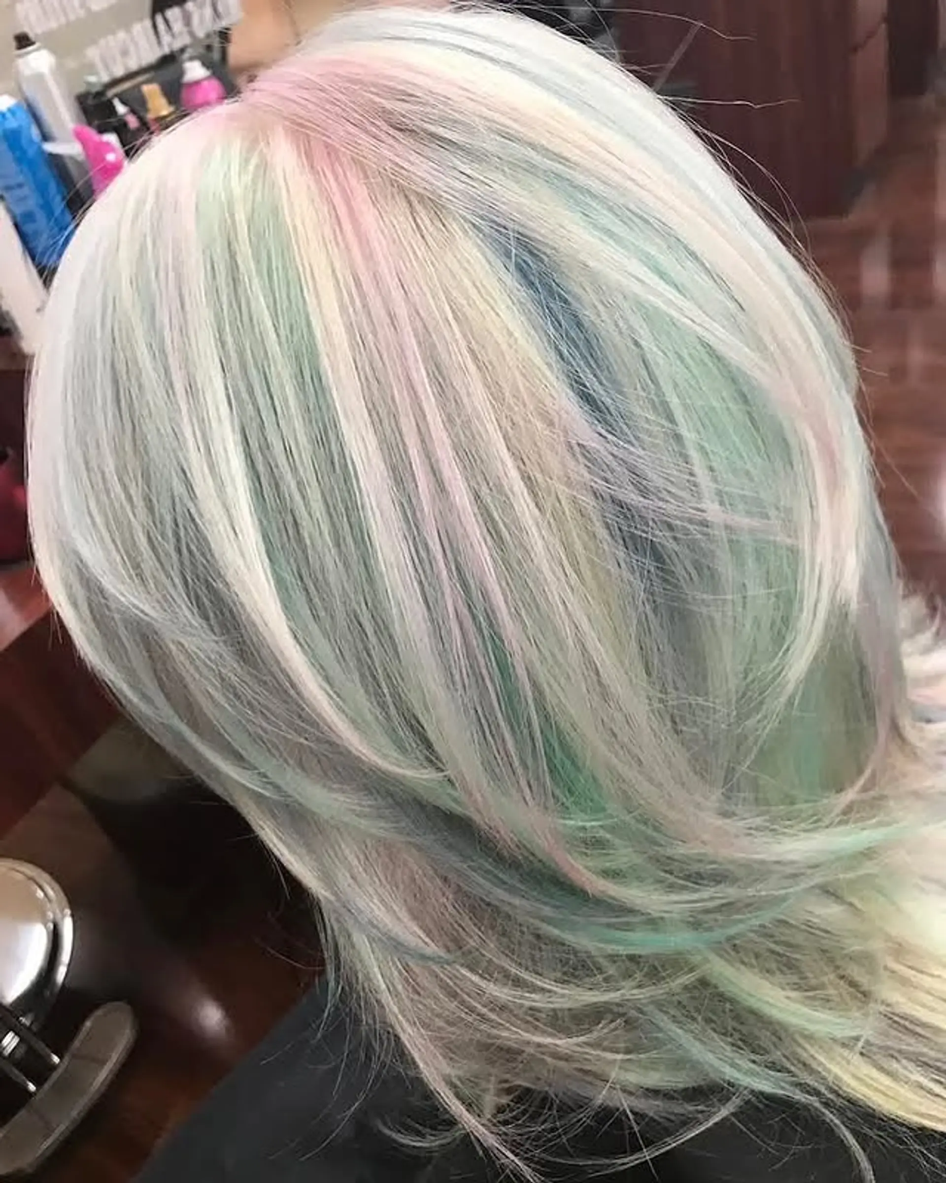 A layered haircut with a pastel rainbow color design. 1