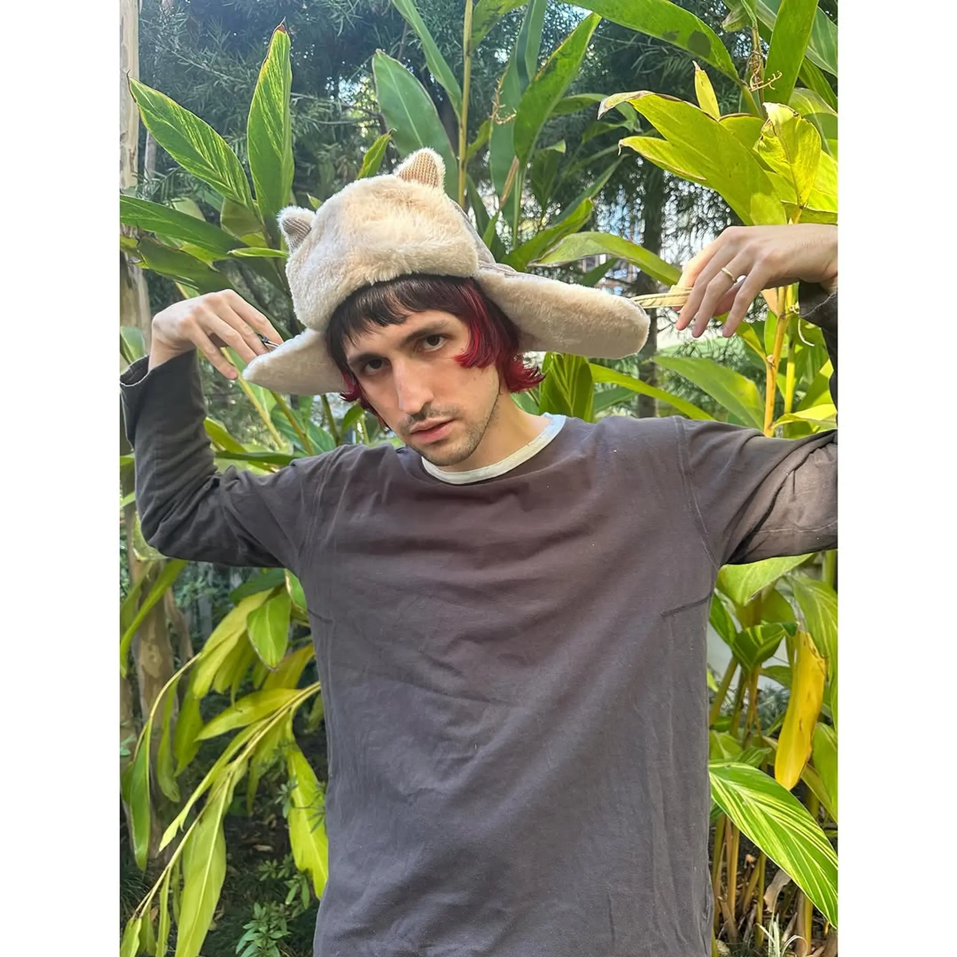 A modern Edgar haircut with blunt bangs and textured ends. 1