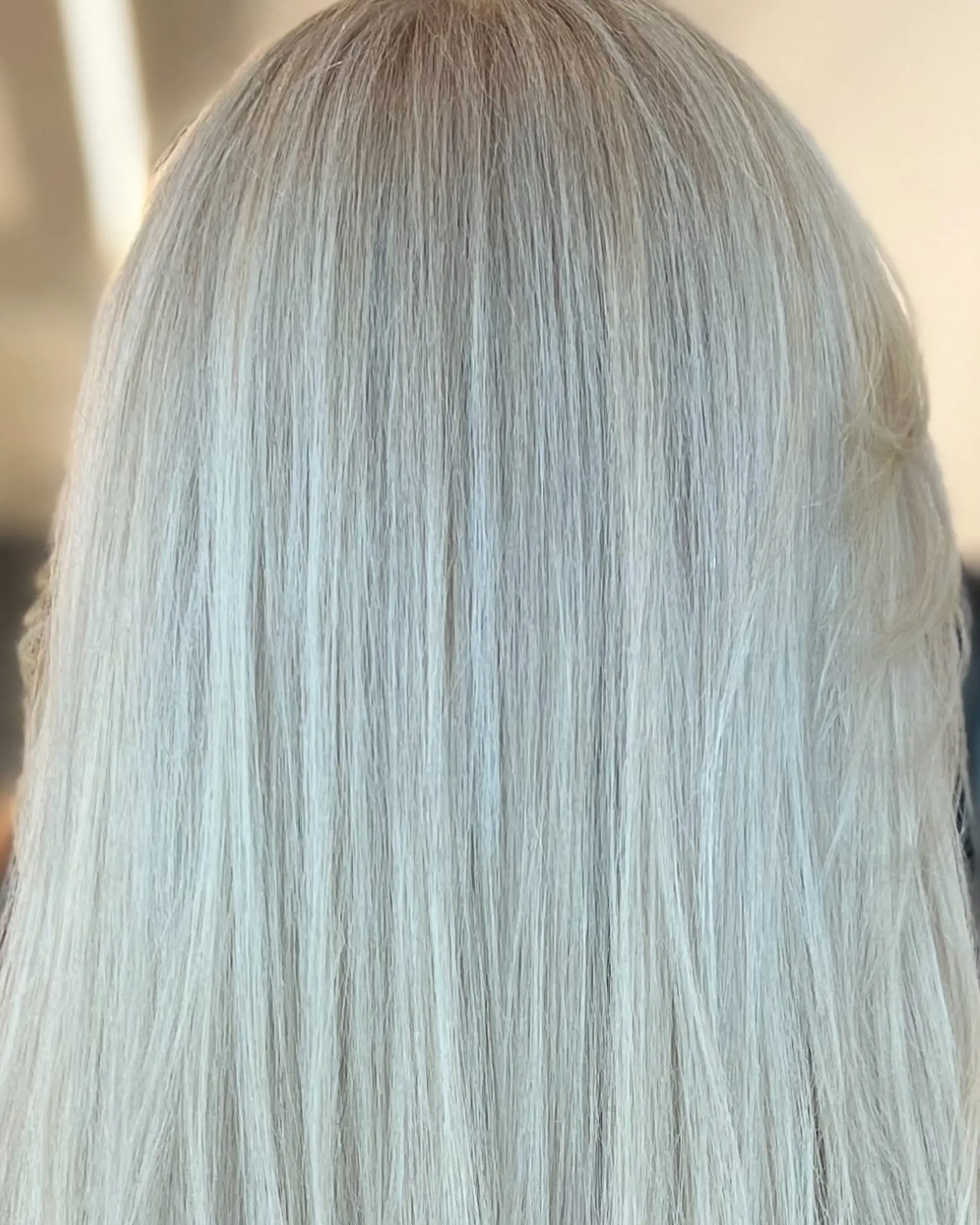 Straight, smooth hair in an all-over cool-toned icy platinum blonde shade. 1