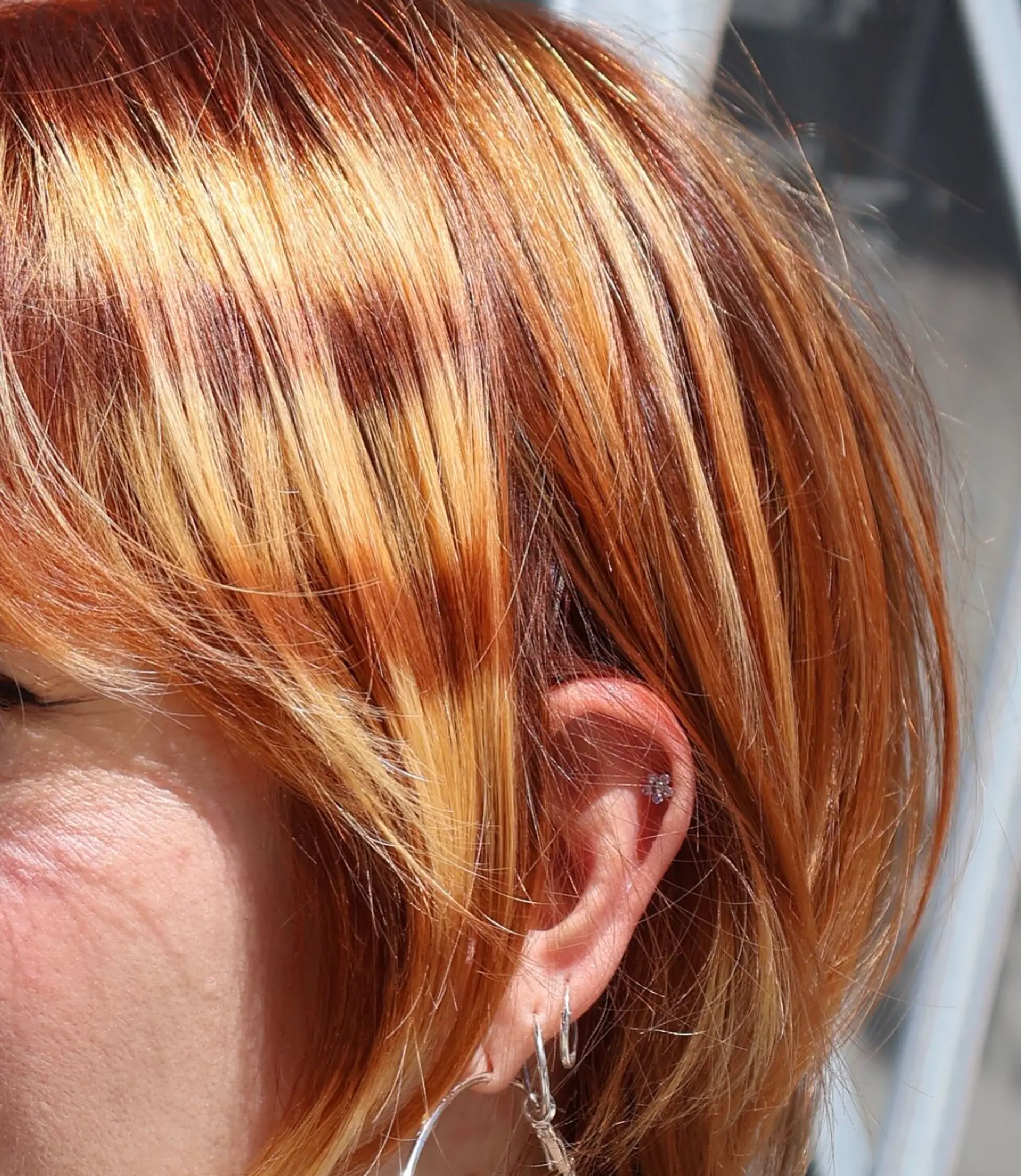 A short,  pixie cut with choppy bangs and layered sides. 3