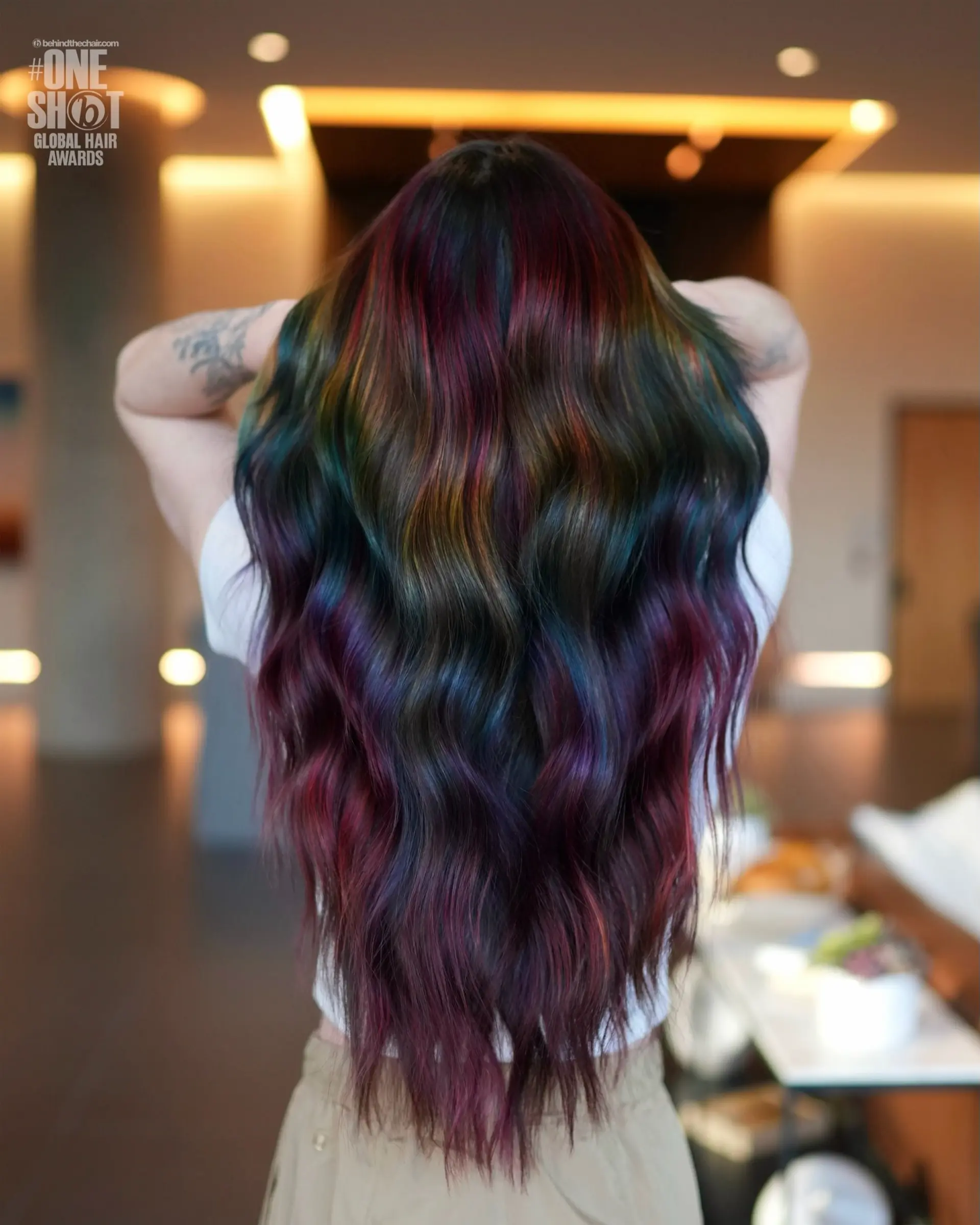 Long, flowing waves featuring a dark base infused with vibrant jewel-toned rainbow ribbons. 1