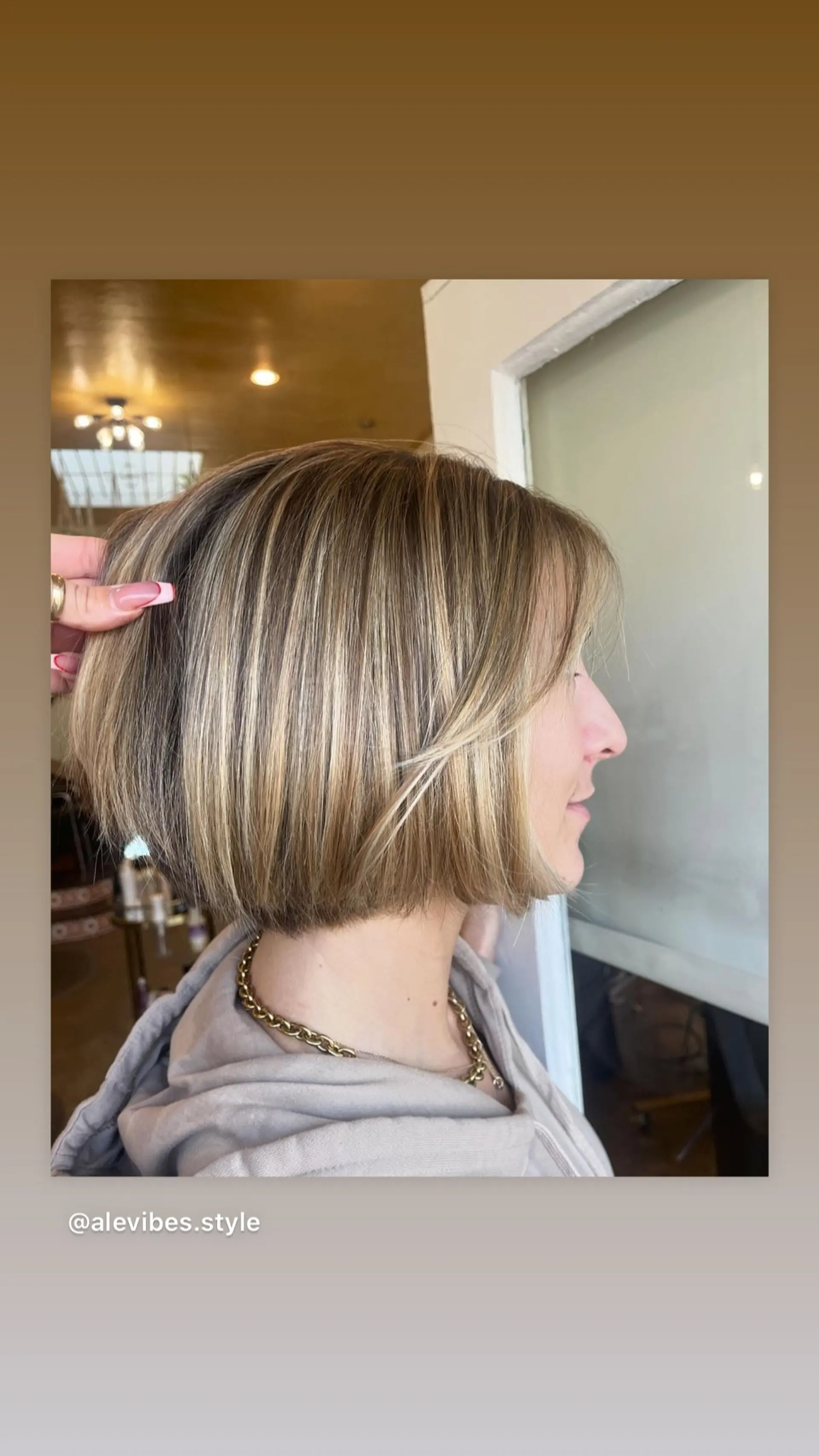 A chic, chin-length bob with face-framing layers and expertly placed highlights. 1