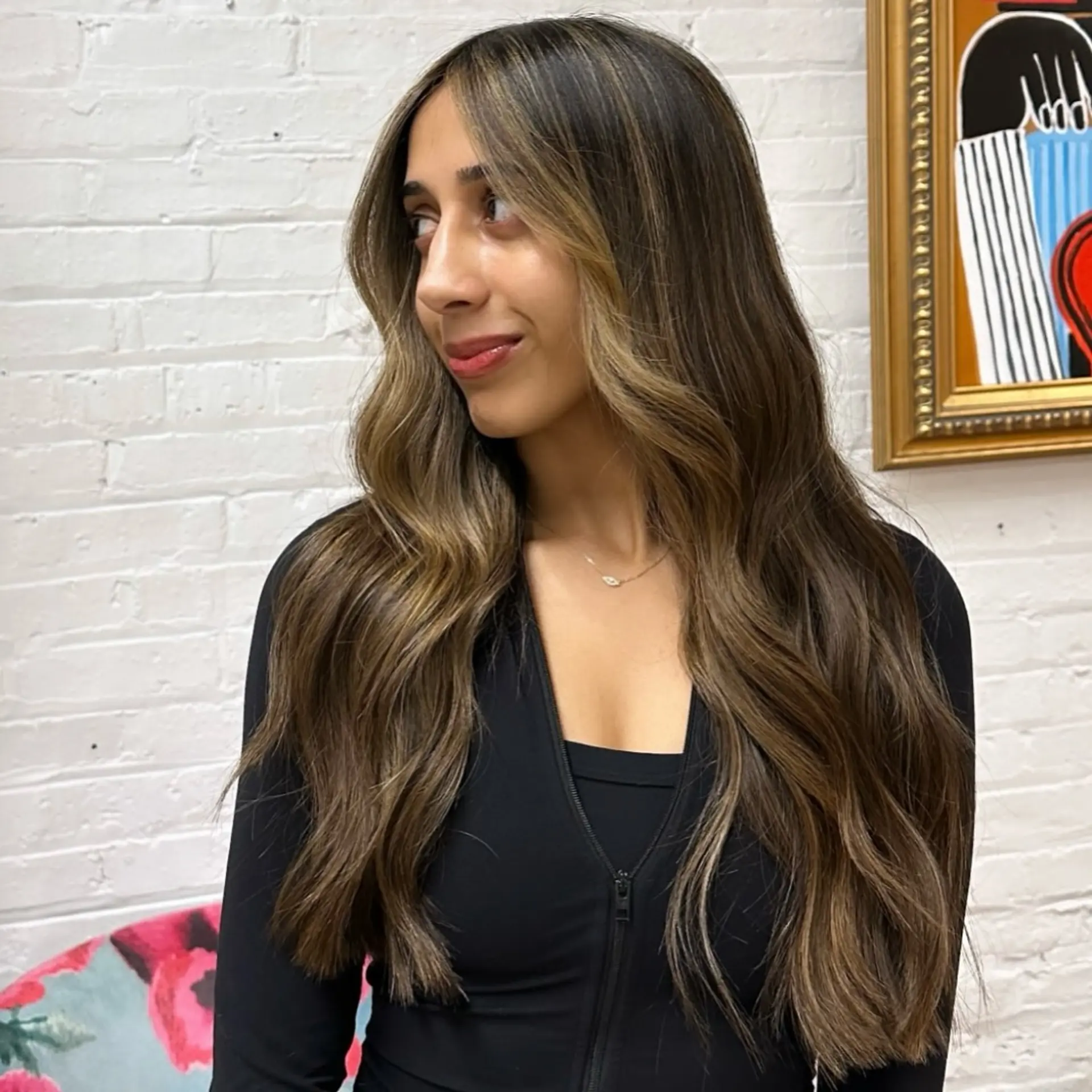 Long, layered waves with a caramel balayage. 1