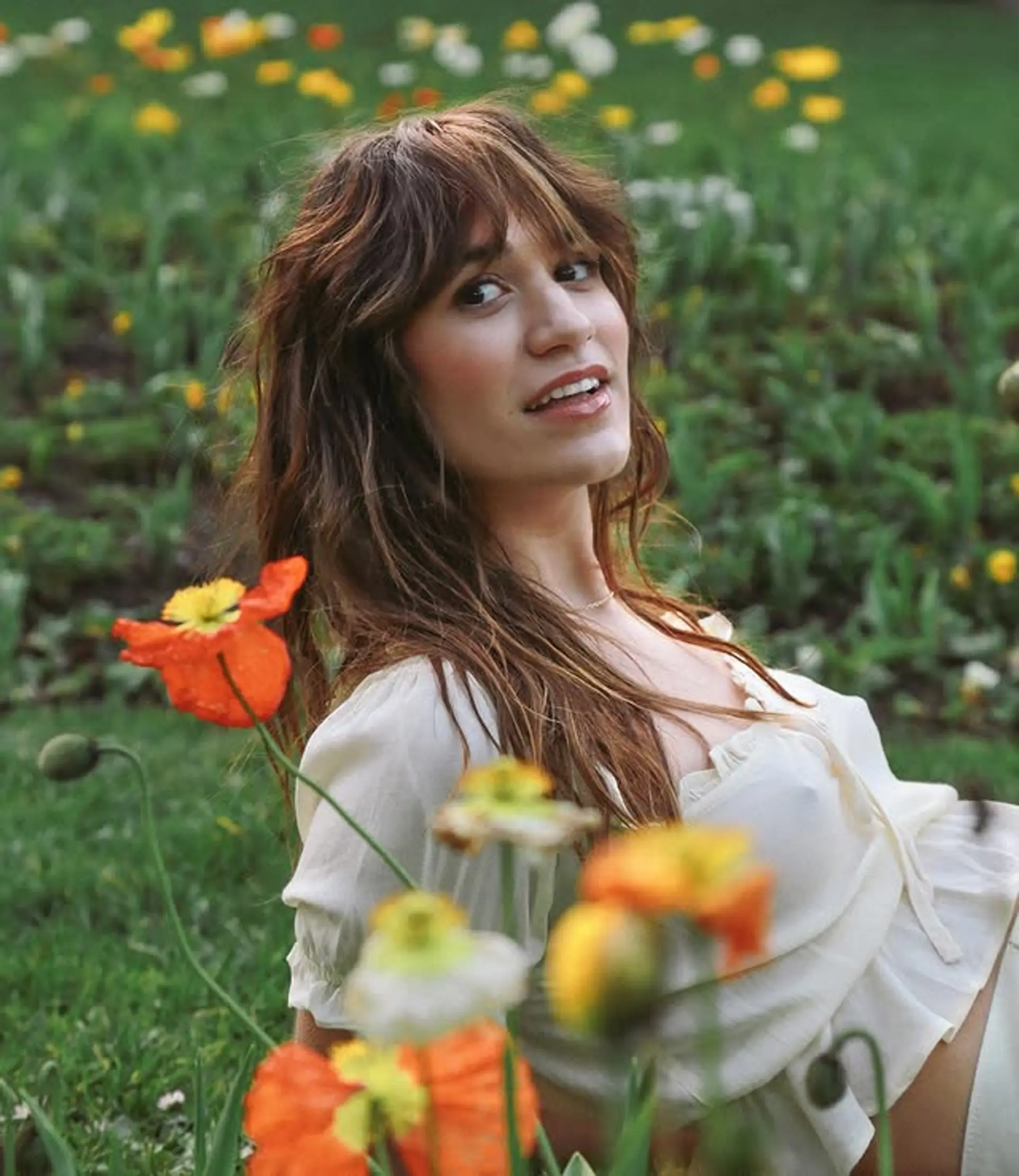 A shaggy, layered cut with curtain bangs, perfect for wavy hair. 1