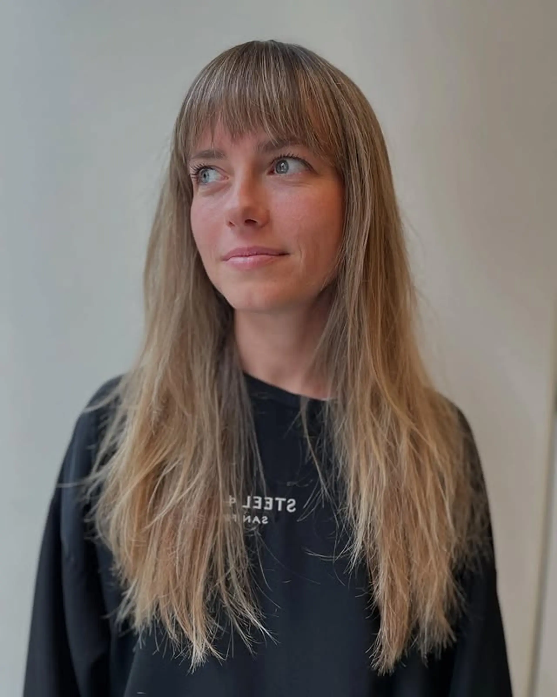 A long, layered shag with face-framing bangs and textured ends. 1