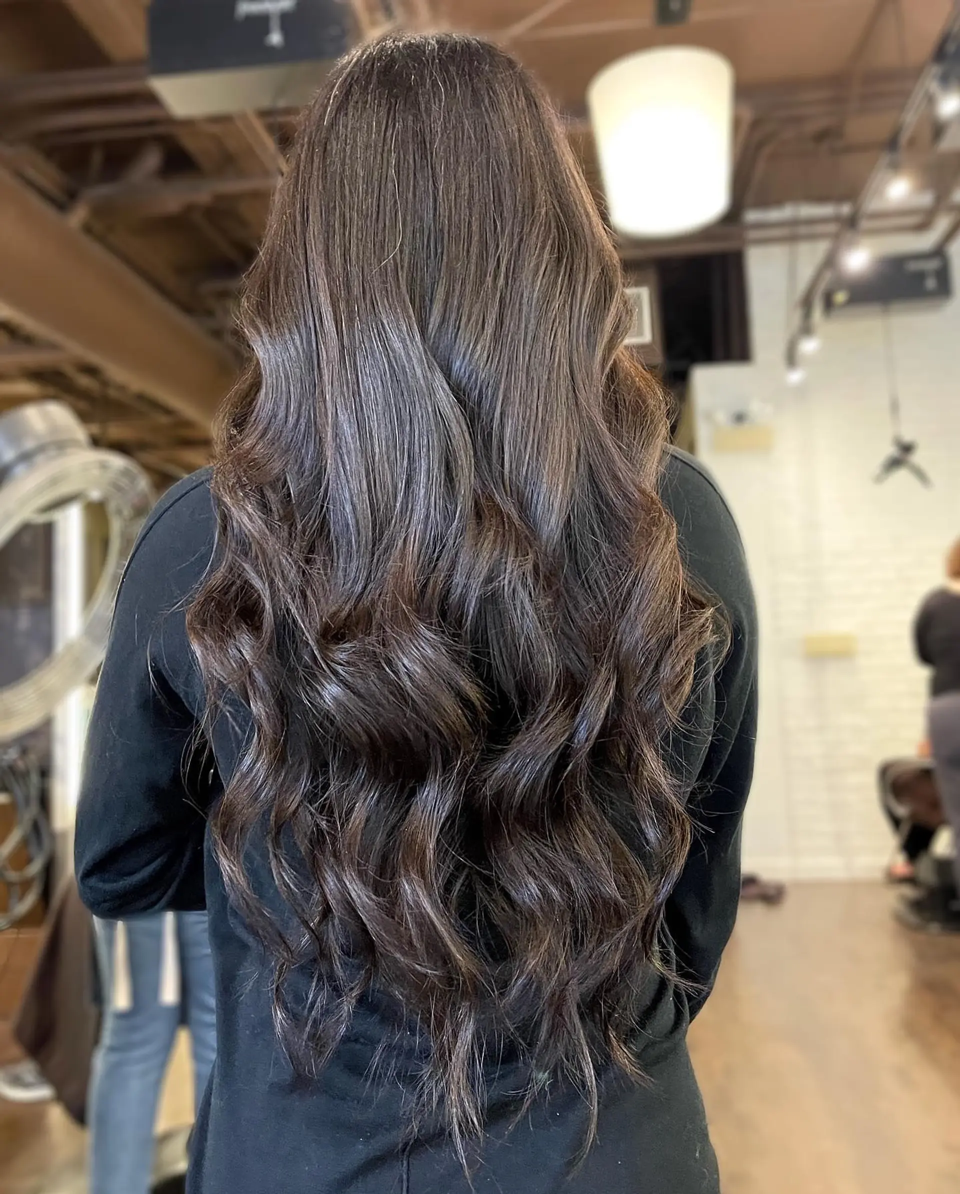 Long, layered waves with a chocolate brown balayage. 1