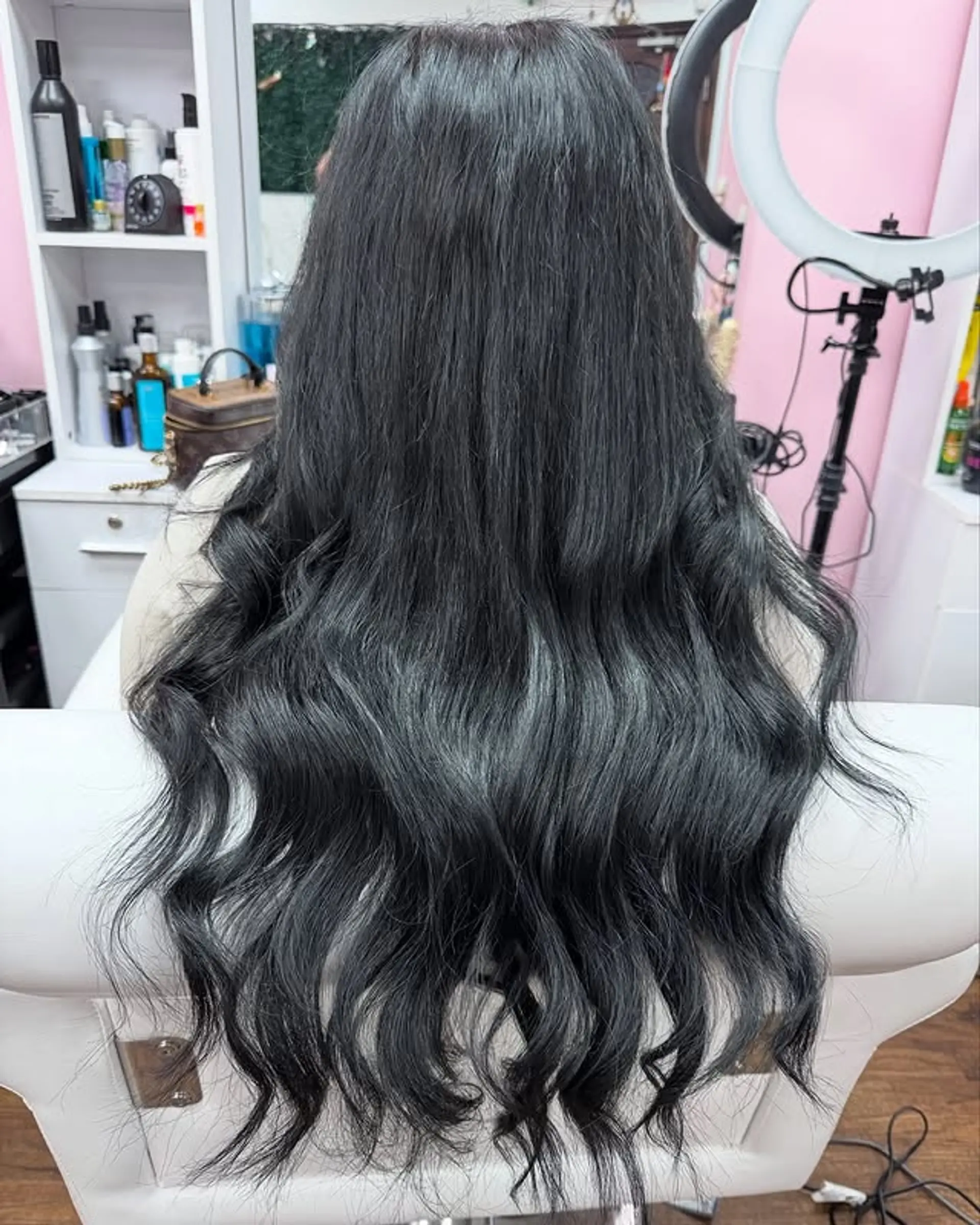 Long, flowing waves in a striking black with a hint of gray. This style is perfect for adding volume and creating a dramatic, yet elegant look. 1