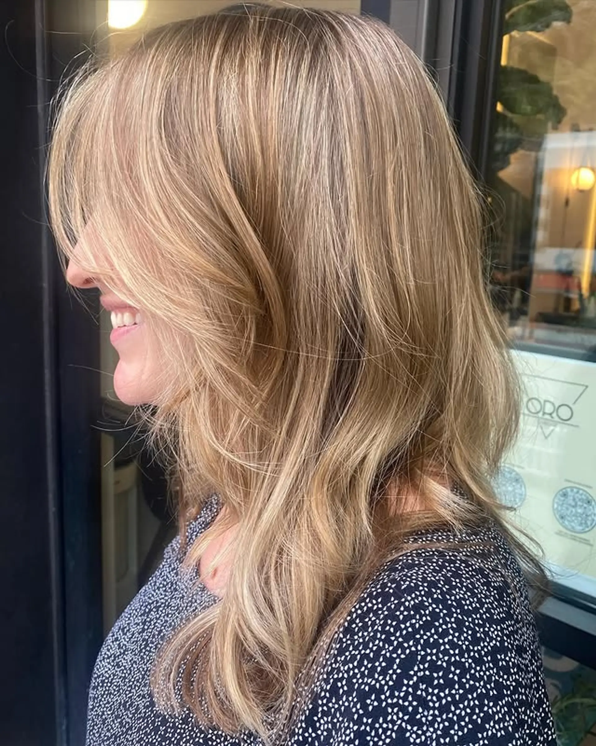 A medium-length layered lob with beachy waves and face-framing. 1