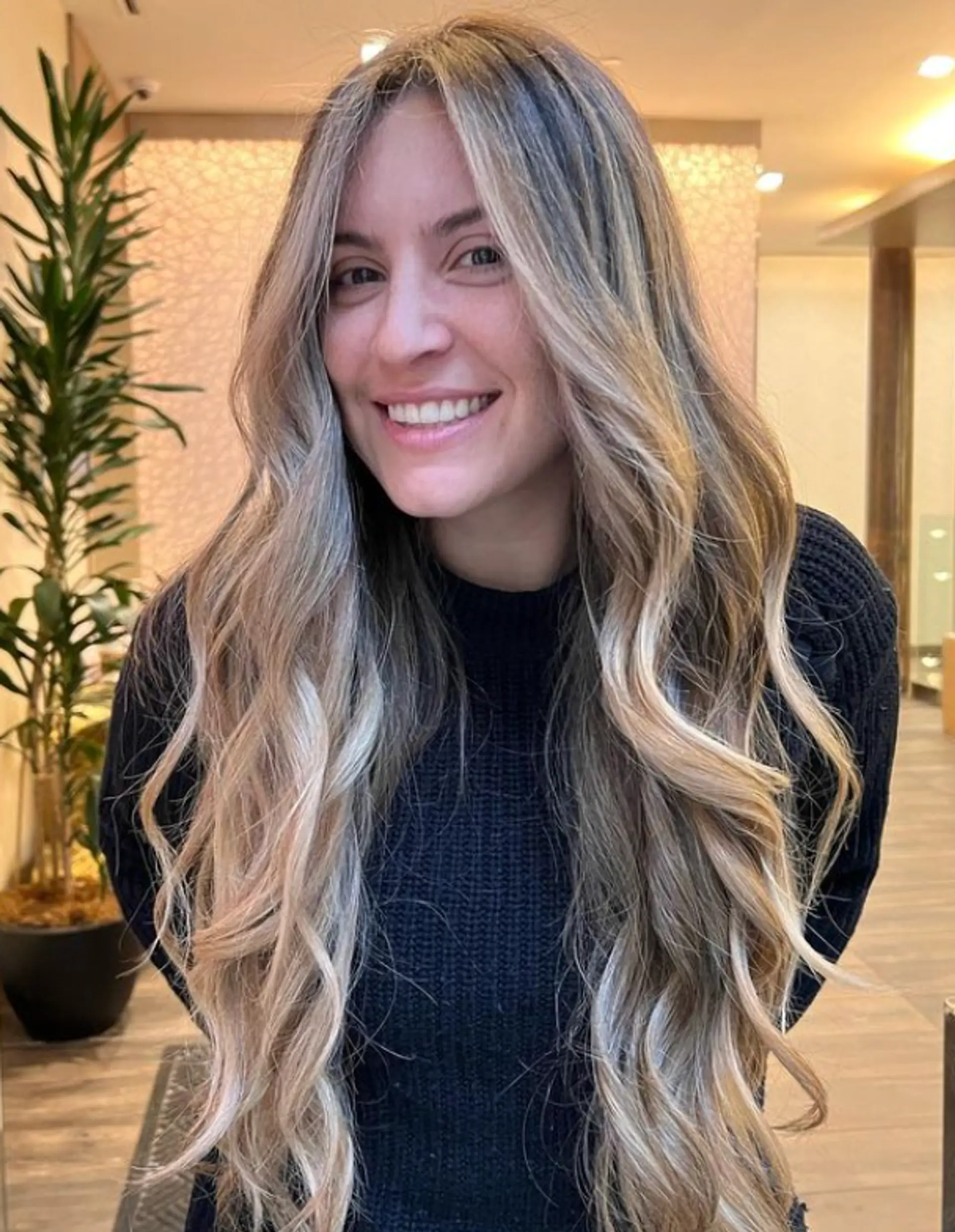 A stunning 'Golden Wave Cascade' hairstyle featuring very long, soft waves with a rich combination of blonde and light brown shades. The style includes face-framing layers and natural-looking curls, creating a sun-kissed, sophisticated look.

Color by @simabeautynyc
Cut and style by @juliamannino_hair
 2