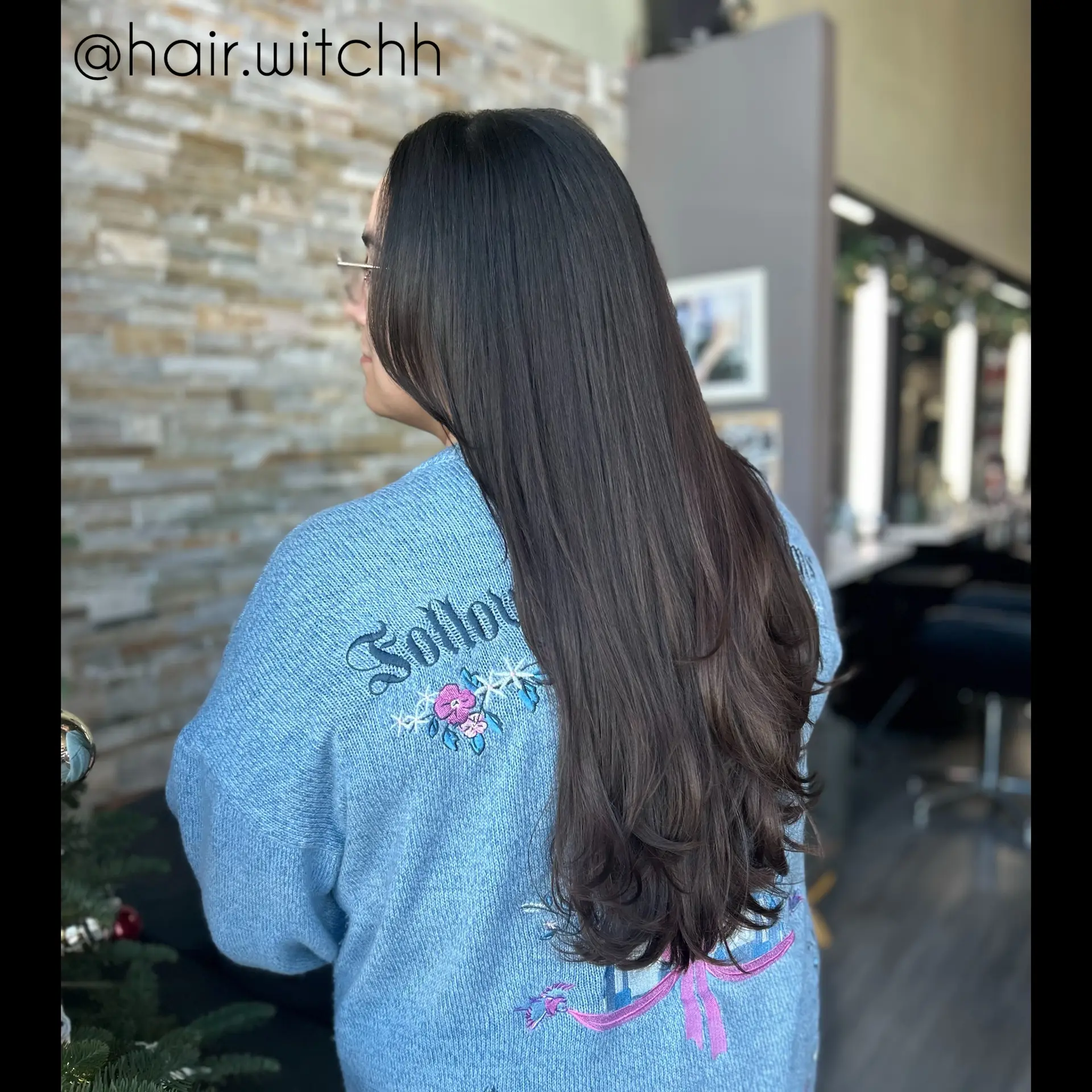 Long dark brunette hair featuring delicate, face-framing layers and soft, curled-under ends. 1