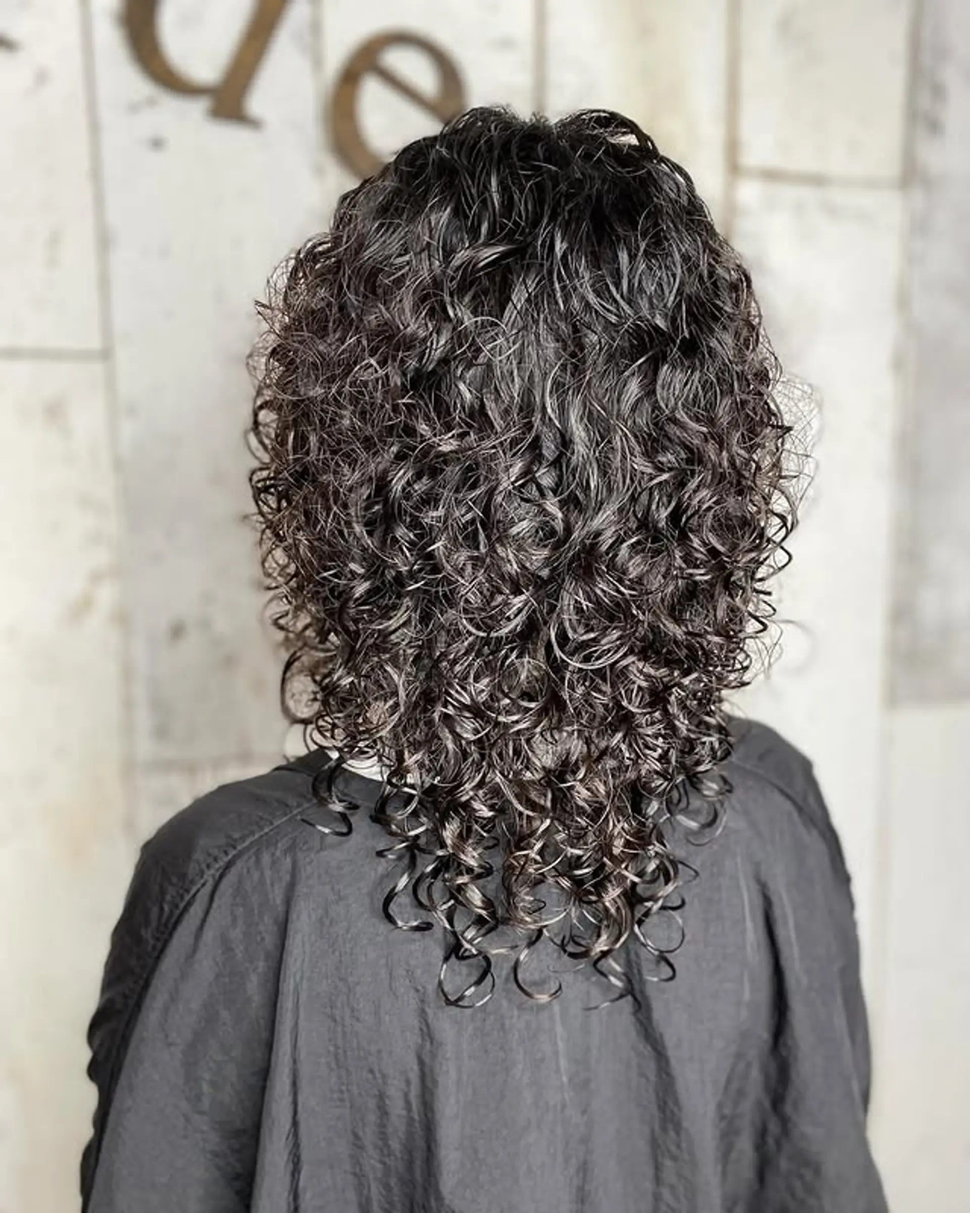 A layered, curly shag that enhances natural volume and shape. 1